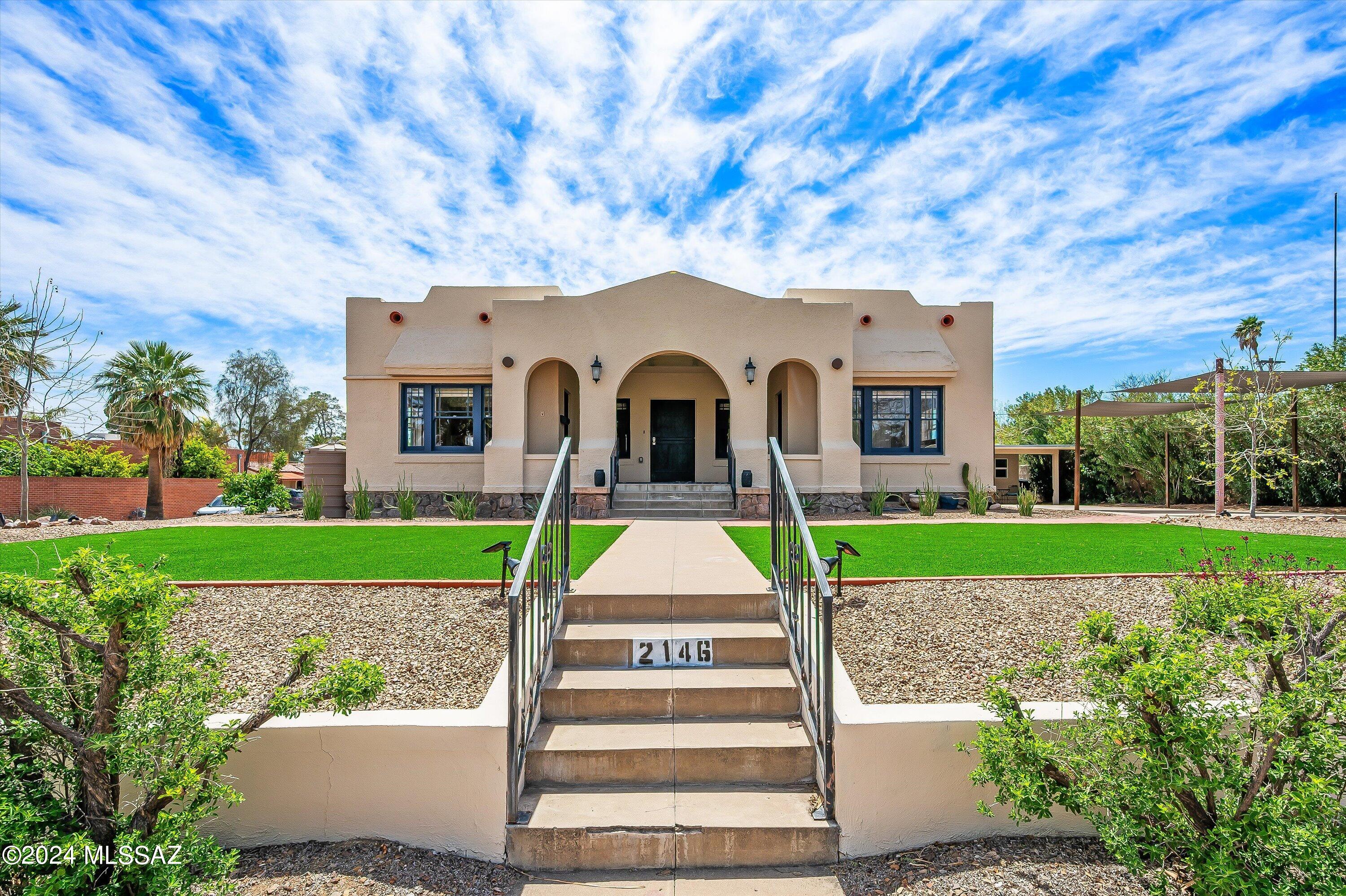 Located just 3 blocks from U of A and Trolly for University Blvd, 4th Ave, Downtown, and Mercado, this updated historic Sam Hughes home offers the perfect blend of Historic Status and convenience. This 4 bedroom 3 bathroom property (3381 total sqft) sits on a large double lot and has room for 6 off street parking spots. The main house is laid out nicely with 2 bedrooms 2 bathrooms on main floor and a bedroom and office/den in basement. There is extra storage in basement and roll up door shop out outside. As an added bonus, this property boasts a charming new guest house, providing a private retreat for visitors or potential rental income.  Complete with a full kitchen, living area, bedroom, and bathroom, it offers all the comforts of home. Come and see for this historic property.