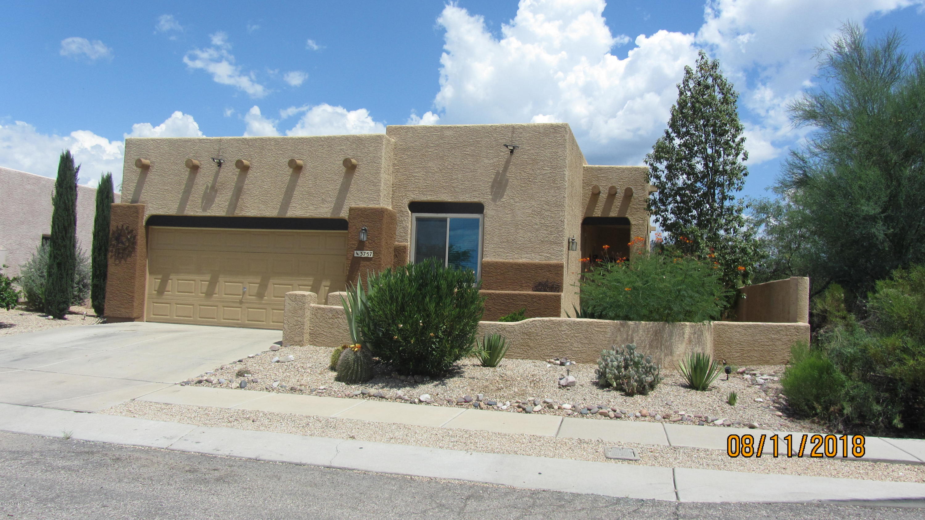 Santa Fe Style home is move in ready and shows pride of ownership.  Good size master bedroom with garden tub/shower, decorative gas fireplace in family room, alarm ready.  Extra bonus room with added doors for privacy could be a great office or bedroom.  Solar powered by Solar City.  Nice small subdivision with only 25 homes.  Great mountain views with lots of privacy in beautiful backyard, great for entertaining.  Home is on cul-de-sac and corner lot.