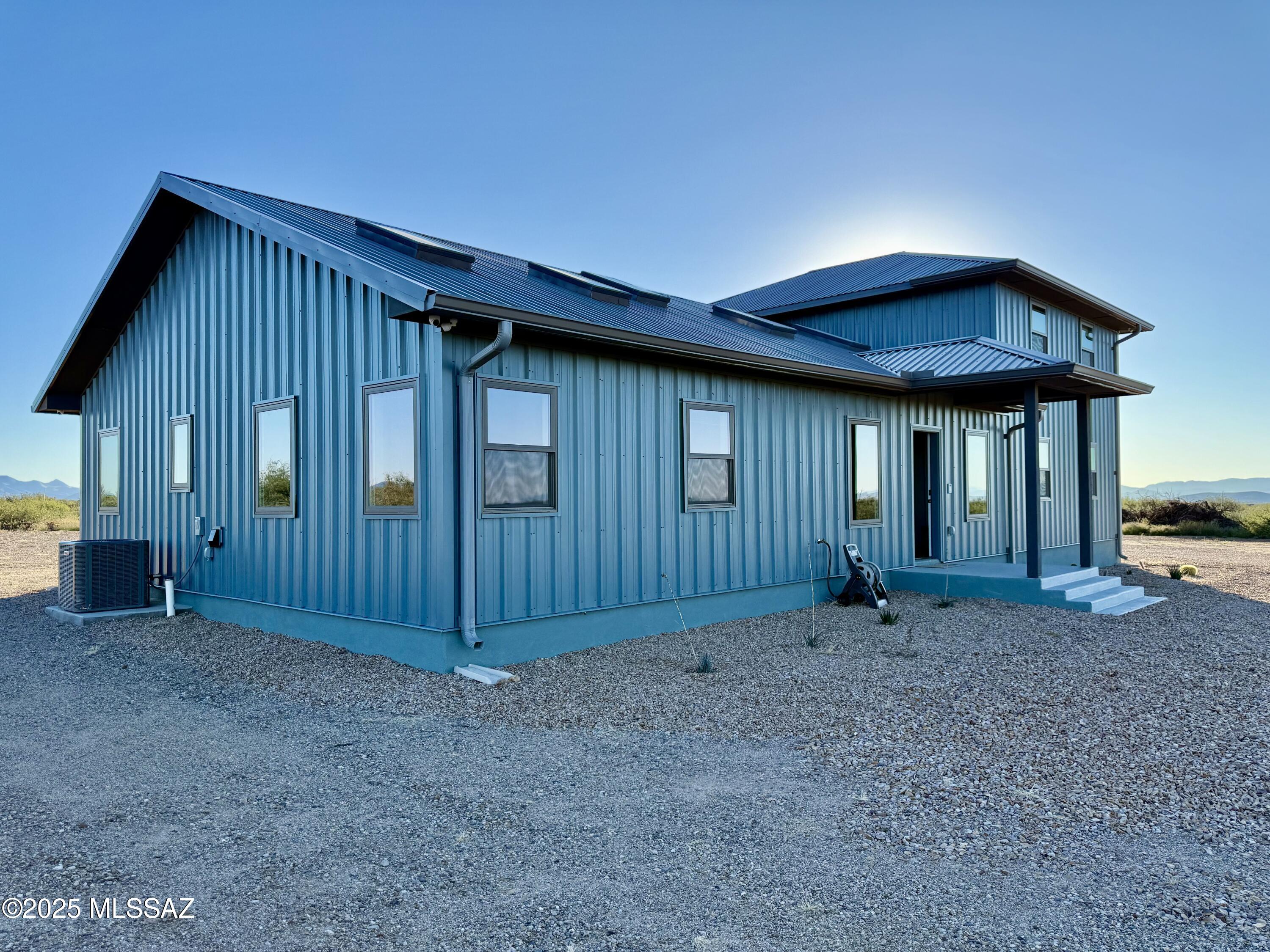 Escape to your own private desert retreat on 6 scenic acres with breathtaking panoramic mountain views & clear night skies-perfect for astronomers and skywatchers alike! This Charming 2-bedroom, 2-bath home with office, upstairs loft area & conjoining dark room that offers the perfect blend of comfort & beauty, Step out onto the expansive deck, ideal for entertaining, relaxing, or setting up a telescope for an unforgettable night under the stars. Desert landscaping for easy maintenance and automatic gate, cameras for added security and peace of mind, with ample space to simply enjoy the serenity of the wide-open surroundings. Whether your seeking peaceful getaway, a full-time residence, or a stargazers dream location, this property delivers.