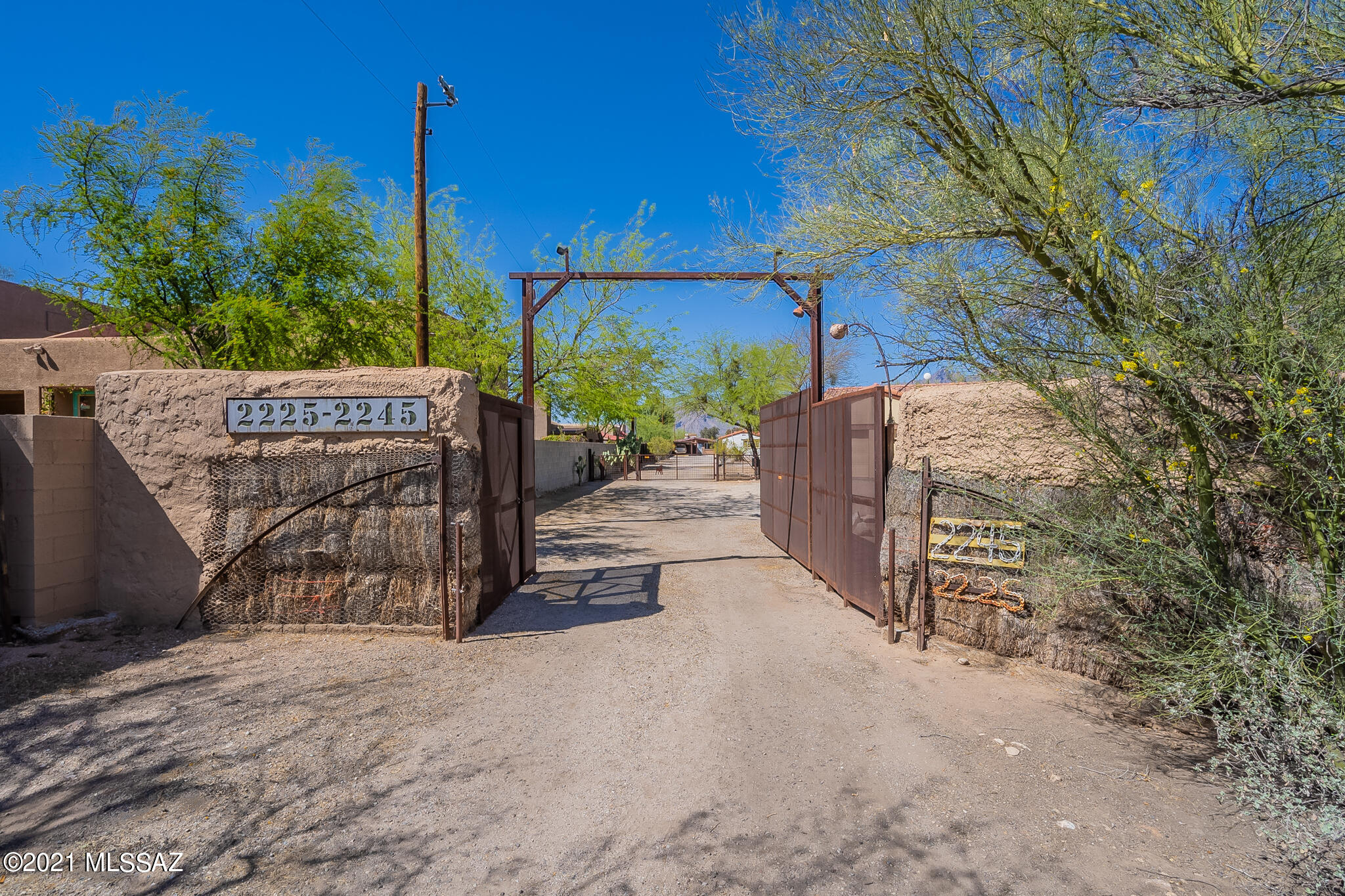 Unique opportunity to own 3 homes on 3.37 acres with sensational views of the Catalinas, located in the heart of town & loaded w/history & charm. Gated & set back from road, very private. Main house  has open, spacious, wonderful floorplan, coved ceilings w/hand hewn beams. Inviting AZ Room overlooking yard, pool & mountains. Guest house w/full kitchen, huge great room & beautiful original concrete floors & workshop. Room for hobbies, gardening, pets & play. Masonry front house w/high ceilings & 2 car garage could be a great rental. All homes have AMAZING mountain views & unlimited possibilities. Huge pool needs to be re-done & entire property being sold ''AS-IS'' (2225 E. Prince built 1996 Tax ID 112-02-012E. 1BR/2BA, 1576 SQFT) No  HOA, No CCRs, No Steps!