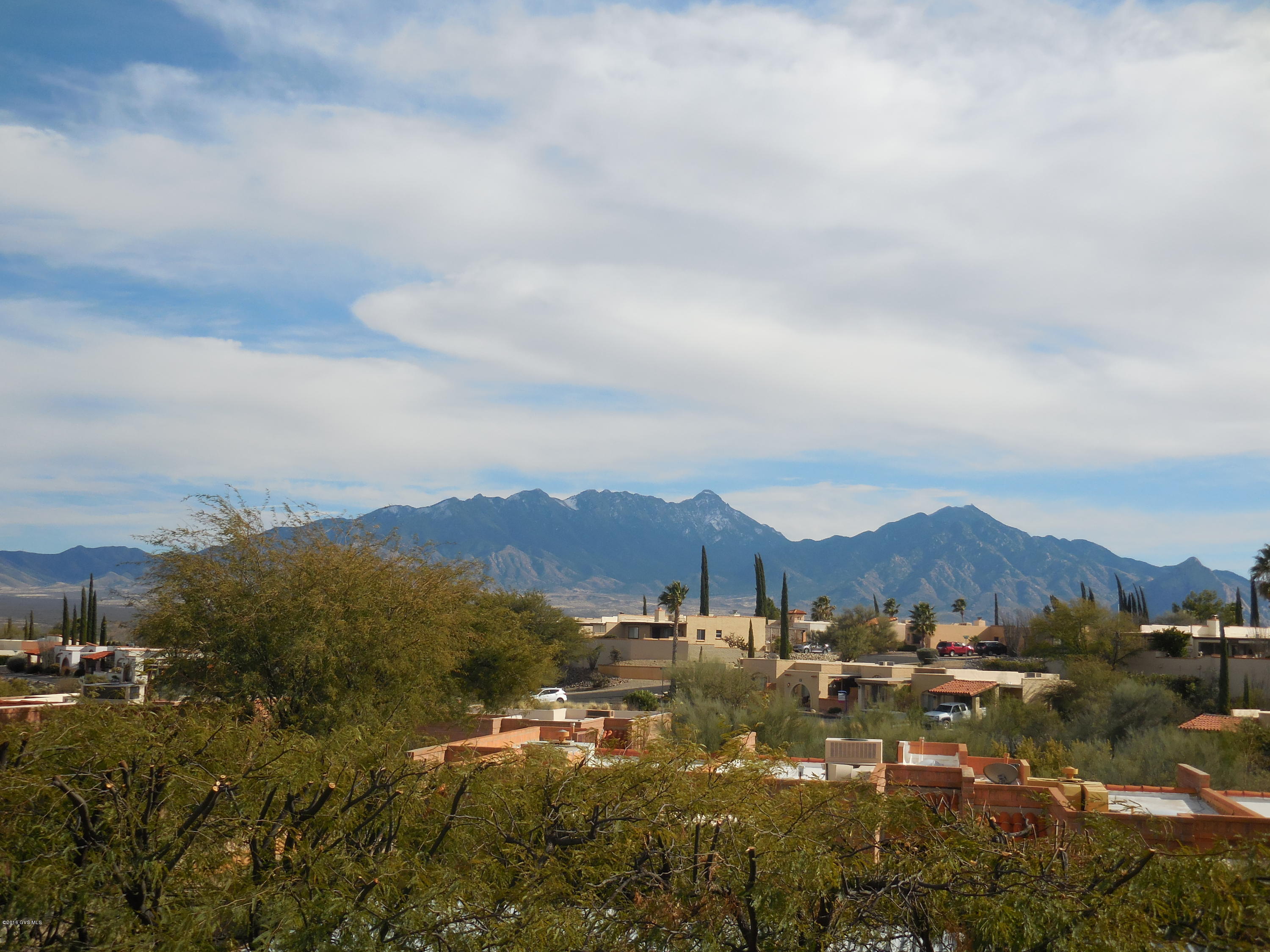 Lovely Desert Casita with awesome views of Santa Rita Mountains. Lovely tile floors and carpeted bedroom. Private tiled South facing patio for morning coffee and beautiful evening pink mountains. Nice furnishings include hide abed sofa and 2 Lazy boys matching recliners and flat screen TV. New appliances 2011 including Bosch dishwasher. New HVAC 2012, roof recoated Jan. 2016, termite warranty. Completely furnished with exception of few items. List of items not conveying at property.