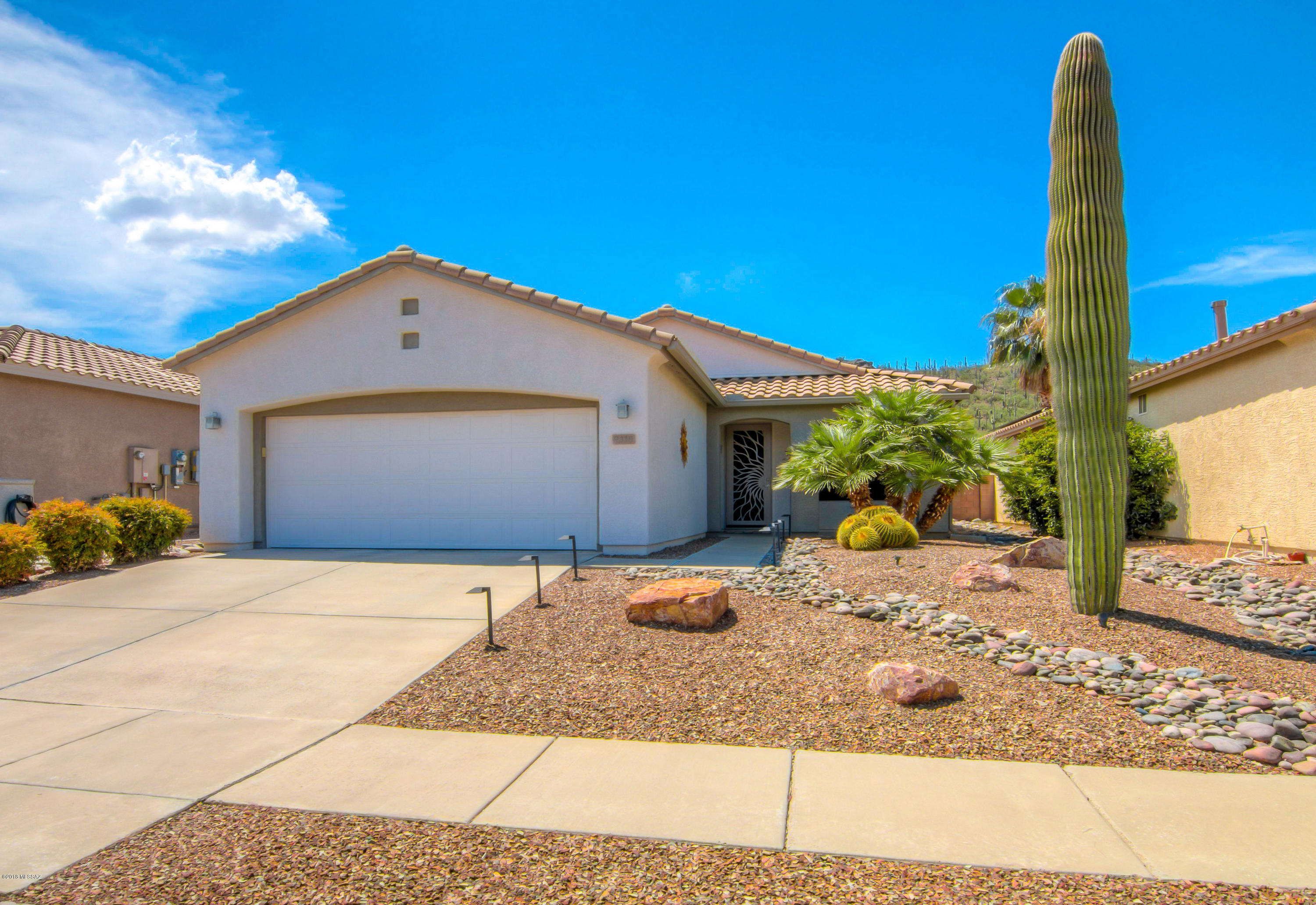 Beautifully Remodeled Home with Tucson Mountain Views! Home features open Family Room, oversized ceramic tile, high ceilings, newer Rheem HVAC system, electric solar system, custom front & back security screen doors, solar window screens, new alarm system, water softener, new washer/dryer & much more. Hall Bathroom w/granite counters & New American Standard walk-in whirlpool tub. Fully remodeled Kitchen has granite slab counters, custom cabinets, under-mount sink & new black stainless appliances. Breakfast/Dining Area w/glass slider to back patio. Master Bedroom has Bay window & private bathroom with custom shower surround. Backyard retreat offers extended covered brick patio, mature landscaping with new irrigation, custom lighting and mountain views.