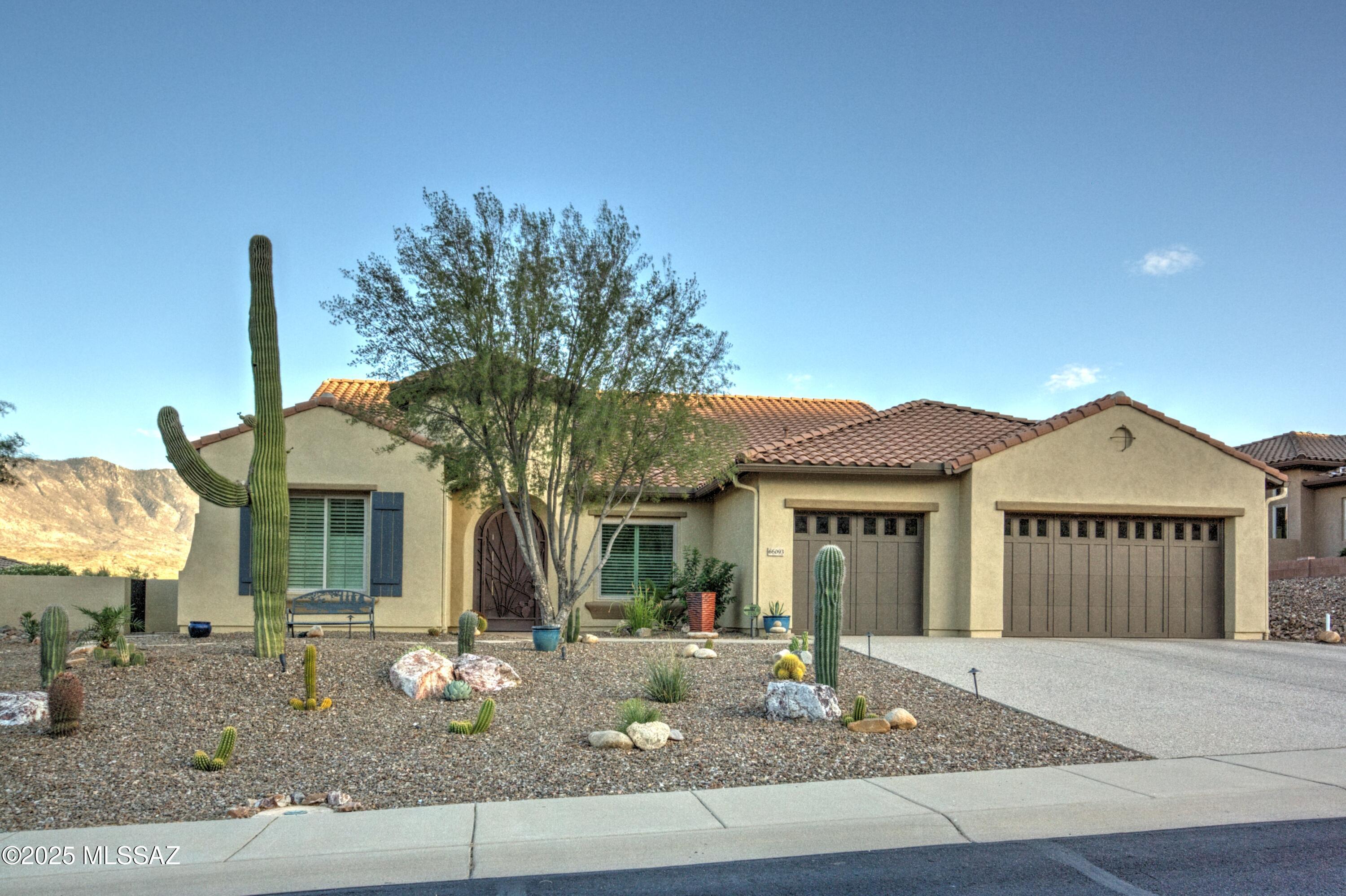 Panoramic views of the Catalina Mountains from this elevated lot on The Preserve Golf Course. The Preserve at SaddleBrooke offers luxury living in a breathtakingly beautiful environment.  SE exposure from the back of the home is ideal for desert living and provides a light filled interior. Newly installed large picture windows in the great room frame the spectacular views. This popular Canyon model features 12 Ft ceilings, engineered wood flooring, gas fireplace and an updated kitchen. Cambria quarts counters with an enlarged island, new sink and faucet with RO water filter, new garbage disposal and induction cooktop. Custom security screen door at the entry and master bedroom.  Come see for yourself, one of the best views in The Preserve. Owner /agent
