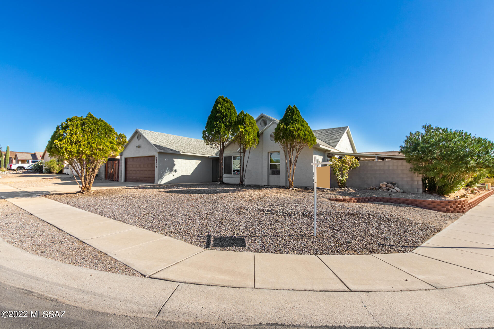 BEAUTIFUL updated 4 BEDROOM, 2 BATHROOM home on LARGE CORNER LOT w/ HUGE BACKYARD with POOL & CUSTOM WATERFALL FEATURE!! Pride of ownership shows throughout, updates include NEW PAINT, NEW FLOORING, NEW RV CARPORT w/ GATE, NEW GARAGE DOOR, ENCLOSED SCREENED PATIO/AZ ROOM & VEGETABLE GARDEN w/ GREEN HOUSE. Lovely, remodeled Kitchen with cherry, soft close custom cabinets, granite counter tops, new dishwasher & updated appliances. NEW ROOF & entire exterior painted in 2018. Other wonderful features of the home include HIGH VAULTED CEILINGS in great room, master bedroom & guest bedroom, a cozy wood burning fireplace in living room & 4th bedroom could be used as HOME OFFICE. TONS OF STORAGE & WORKSHOP IN GARAGE.  Great northwest neighborhood. **Financing Assistance Available, ask about details