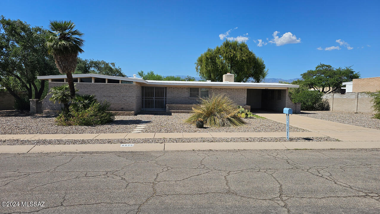 Welcome to this amazingly large lot with 2 oversized bedrooms. No HOA. Minor updates may need to be made but this home is completely move-in ready. There are great plants in the private back yard and a peaceful covered (north facing) patio that you can enjoy looking at the famous Catalina Mountains. This home has unique character and fun architectural touches including the stylish ''breeze blocks'' and raw mortar exterior design flair that are exceedingly rare to find. This house also has touches of late-era mid-century modern  design styles that have stood well with the test of time. If you are looking for a versatile space with lots of yard, you have found your next home here! Water heater recently replaced, most windows upgraded too!
