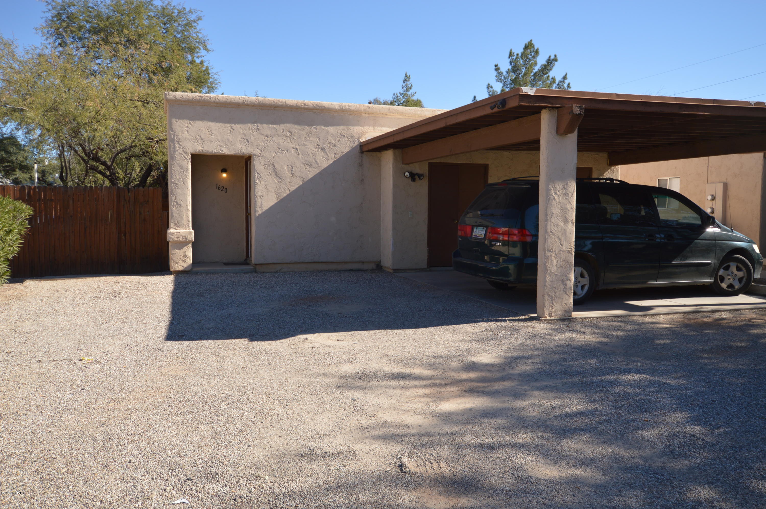 Fantastic 2 bedroom duplex. Large rooms, spacious and open floorplan. Well equipped kitchen with range and refrigerator. W/D hookups and water is paid by owner. Comfortably air conditioned with economic central heat pump. Large fenced yard with lots of room for entertaining. Includes one carport space and a storage room. Quiet, comfortable and easy access to everything.  CALL TODAY!!