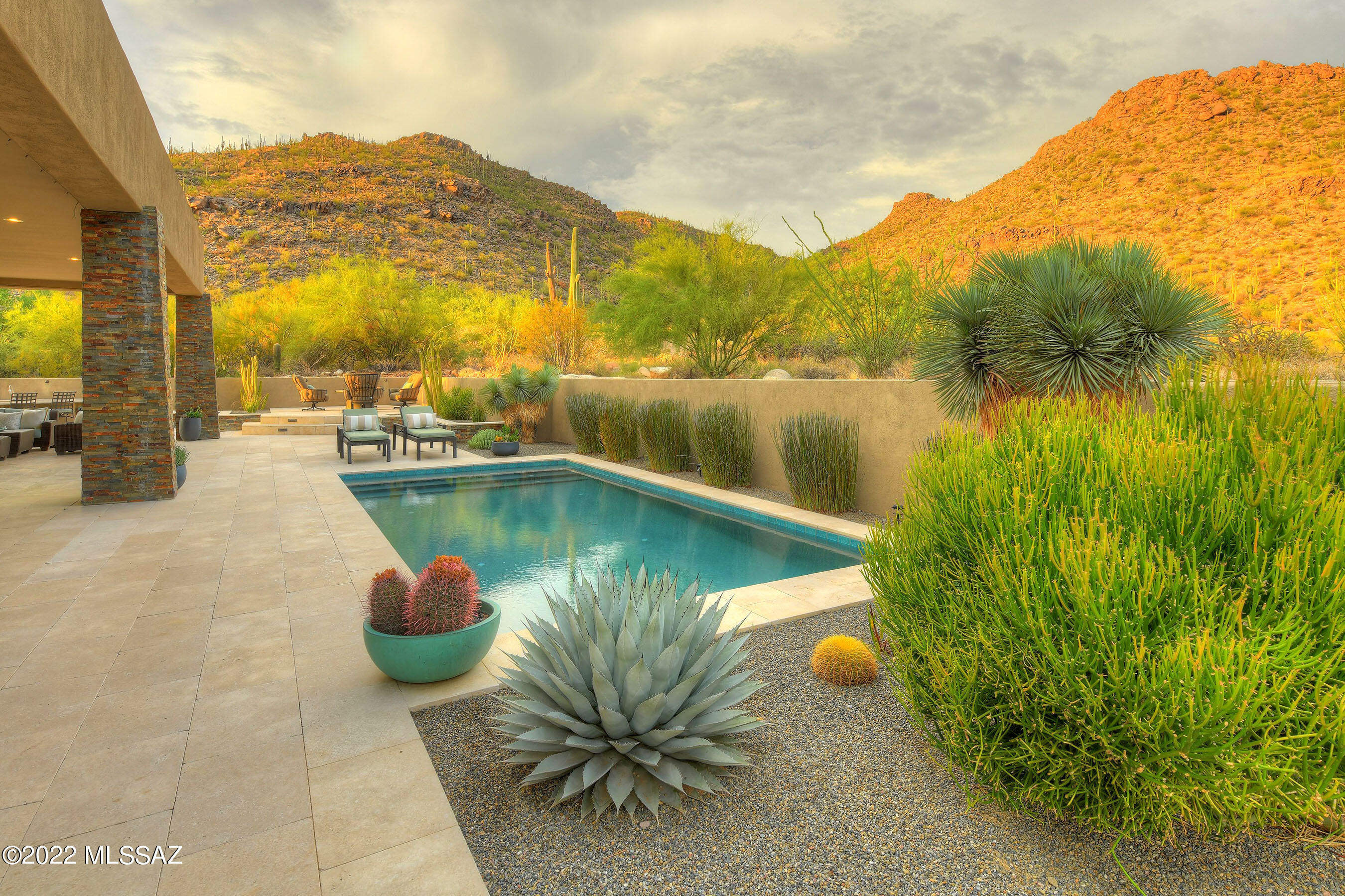 *MODERN ELEGANCE* STUNNING DESERT CONTEMP DESIGNED BY MARC SOLOWAY. BORDERS THE ''GALLERY'' GOLF COURSE - OFFERS SEAMLESS CONNECTIONS TO SONORAN DESERT! EXPERIENCE TOTAL ''SERENITY & TRANQUILITY'' IN THIS HOME! CASUAL FLRPLAN BOASTS WALLS OF GLASS BRINGING IN ABUNDANCE OF LIGHT & MAGIC... BUILT FOR ENTERTAINING & ENJOYMENT! GATHERING RM HOSTS FULL BAR/SUBZERO WINE COOLER/REFRI DRAWERS, SUSPENDED GAS FP-LINE OF FIRE, INTERESTING CEILING/LIGHTING DESIGN- CREATES A UNIQUE DINING EXPERIENCE.  HEART OF THE HM- CHEF'S KIT W/SS INDUSTRIAL APPLIC, ABUNDANCE OF CTRS/HUGE WORK ISLAND DESIGNED FOR PERFORMANCE & FOCAL POINT! OUTDOOR LIVING AT ITS BEST...LIMESTONE PATIOS, LINEAR POOL, BBQ/KIT AREA, FRUIT TREES & BREATHTAKING VIEWS FOREVER! GUEST CASITA, EN-SUITE BR'S, OFFICE/DEN, +MEDIA RM! OWNER/AGENT TIMELESS "MODERN" DESIGN- SIMPLE LINES AND CLEAN FRESH COLORS KEEP THIS HOME IN STYLE FOREVER!  FILLED W/FINE APPOINTMENTS & EXQUISITE FEATURES- NATURAL LIMESTONE FLOORING, EXTERIOR STONE INVITES ITSELF IN, LOTS OF TEXTURE & DESIGN BRING WARMTH TO THIS CONTEMPORAY HOME- BY USING GLASS TILE ACCENTS/NATURAL STONE /QUALITY WOOD CABINTRY! PRIMARY BEDROOM SUITE - FEELS LIKE YOU STEPPED INTO A "SPA" BATH, OVERSIZED GLASS ITALIAN TILE WALK IN SHOWER,  "FREE STANDING" SOAKING TUB, DOUBLE FLOATING VANITES- QUARTZ CTRS & CUSTOM DESIGNED CLOSET SYSTEM. ATTRACTIVE "OPEN" OFFICE W/BUILD IN EXPRESSO FILE/CABINETS,QUARTZ CTRS, THICK FLOATING SHELVES FOR YOUR TREASURES, FRENCH DOORS LEAD TO SIDE PATIO- MAKES WORKNIG AT HOME A TREAT! MAIN HOUSE OFFERS GUEST EN-SUITE- WELL DESIGNED BATH, HUGE WALK IN SHOWER, FLOOR TO CEILING TILE, FLOATING VANITY- YOUR GUEST WILL LOVE IT! WONDERFUL MEDIA ROOM- INCLUDES SURROUND SOUND, CONTROL 4 AUDIO SYSTEM , 65" 4K TV- COULD BE 4TH BEDROOM! DRAMATIC POWDER ROOM - HIGHLIGHTS A CUSTOM ACACIA WOOD VANITY, PENDANT LIGHTING, EVEN A WALK IN SHOWER - 4TH BATH!
WELCOMING COURTYARD IS FILLED WITH UNIQUE CACTI SPECIMENTS, SOOTHING WATER FEATURE, SUNSET PATIO TO EXPERIENCE TUCSON'S INCREDIBLE SUNSETS! 3 CAR GARAGE - ALL SEPERATE DOORS- IS SPOTLESS...EXPOXY FLRS, ELECTRIC CAR OUTLET, HUGE STORAGE ROOM WITH SHELVING! THIS HOME IS ONE OF A KIND...ON THE BEST LOT IN SOLANA@ DOVE MTN
ONE OF THE OWNERS IS REAL ESTATE AGENT IN AZ
