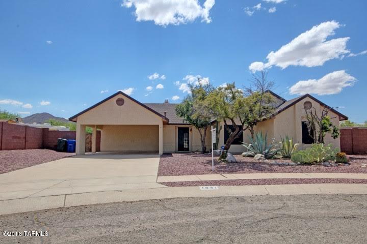 Spectacular home owned by celebrity Chuck Williams is now for sale! Enjoy 80K in upgrades including new roof, HVAC, new stove, fully updated kitchen & baths, tile and wood laminate floors throughout. Vaulted ceilings, espresso cabinets, stainless appliances, updated electrical panel, fireplace in the living area, french doors out to spacious block wall surrounded yard.  You can't beat this one owner home on quiet 1/4 cul-de-sac lot in the Tucson Mountain foothills.  Close to Pima College, Starr Pass, I-10 and vibrant downtown.  Home warranty and termite warranty are included.  Don't miss this star studded property that's priced right!