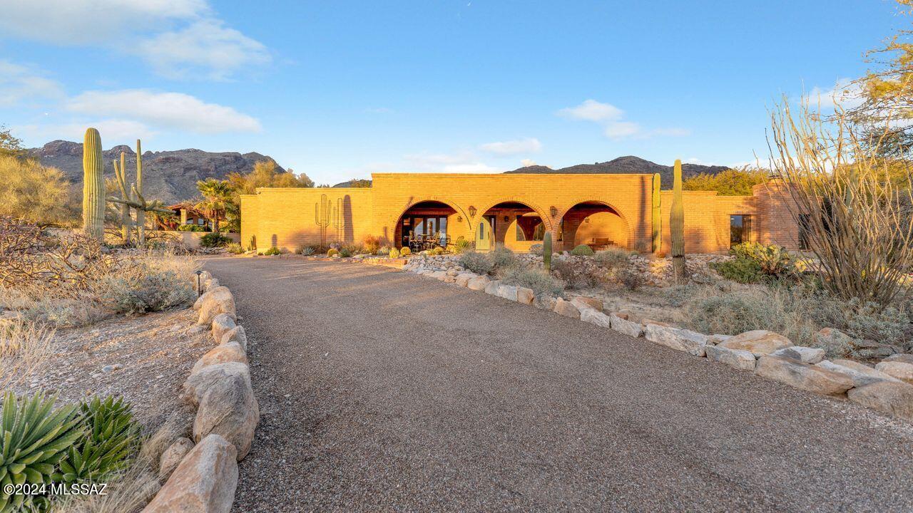Welcome to your dream home nestled in the prestigious gated community of Sin Vacas, right in the heart of Catalina Foothills. This adobe brick, one-level residence boasts 4 bedrooms, offering a perfect blend of comfort and sophistication.
As you step inside, you'll be greeted by the warmth of tiled flooring throughout, complemented by the breathtaking backdrop of the Catalina Mountains. Mountain or city view from almost every room. The thoughtful design and meticulous care are evident, with recent upgrades including two HVAC units 2021, pool heater, owned solar panels, and a home water filtration system.No interior steps, one level.
The backyard is your private oasis, featuring a refreshing pool for those sunny Arizona days, a shady patio with gas fireplace for entertaining. The heart of this home lies in its spacious kitchen, equipped with high-end appliances, making it a chef's delight. Whether you're entertaining guests or preparing family meals, this kitchen is both functional and stylish.
Convenience is key with this prime locationclose proximity to shopping, outdoor trails, groceries, and an easy commute to the University of Arizona and downtown. This is not just a house; it's a lifestyle upgrade. Don't miss the chance to make this stunning property your own. Schedule a tour today and experience the epitome of Catalina Foothills living!