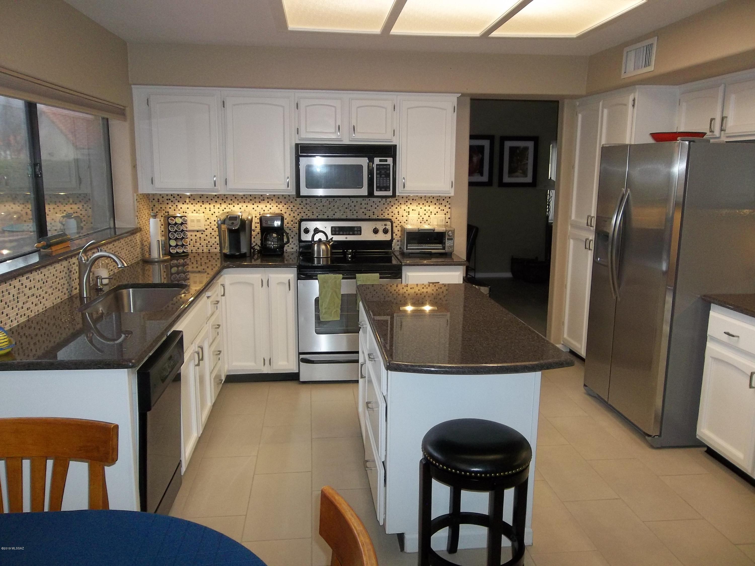 Must see this great home in desirable foothills subdivision. Shows like a model home! 4 BR, 2 BA (4th used as an office), split bedroom plan. 2 BR's have private door & bath for privacy.  Updated kitchen w/granite counter tops & large center island. Backsplash accents this light & bright kitchen. Master bedroom with walk out patio, walk-in closet, double sink in bath with separate shower & garden tub. Large living & formal dining area make for great entertaining. Large family room with cut travertine fireplace. Family room opens to screened in patio for indoor/outdoor living. Expansive back yard on one of the biggest lots in the subdivision. Built in BBQ, concrete patio & basketball/play area. Large grassy area great for pets. No need to preview.