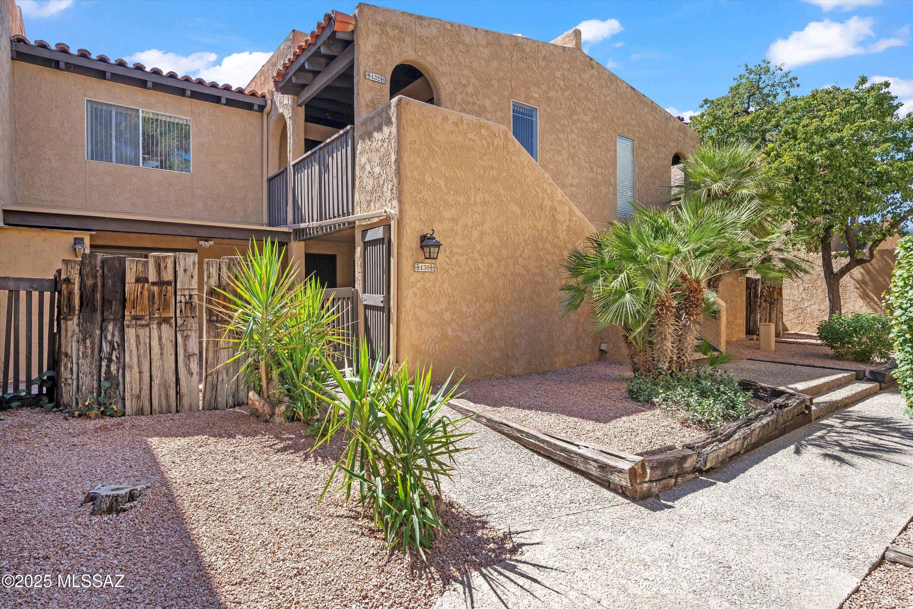 Wonderful second floor condominium with high ceilings and lots of light!  Tiled throughout. Cozy family room with a fireplace.  Spacious, updated kitchen with dining area!  Quartz countertops in kitchen with stainless steel appliances.  HOA dues include heated pool, spa, garbage collection, exterior pest control, maintenance, roof repair & replacement, one covered parking and lots of guest parking. Close to El Con, Randolph Park, Reid Park Zoo, U of A, restaurants and more!