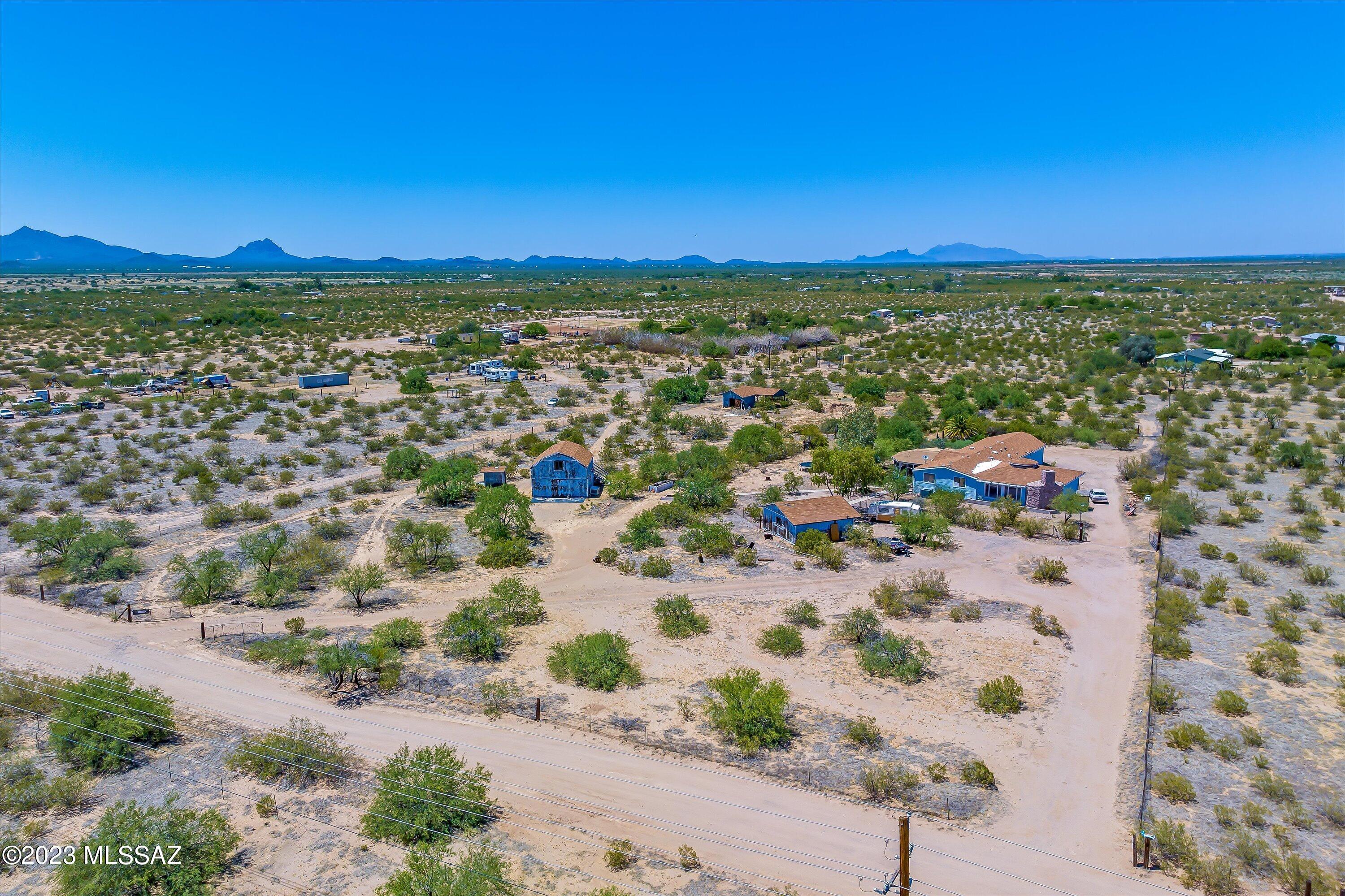 *New roof on garage and house* 5 Acres of beautiful country living. Large 4bd/2bth manufactured home with a 1,024 sqft attached family room/game room with an exquisite flagstone fireplace for entertaining. Also attached is a huge 455 sqft screened front porch and 732 sqft storage area. There is a 2 car detached garage. There is a barn with a loft and outhouse. There is also another covered storage area. Property completely fenced with water spigots throughout property. Perfect property for horses and farm animals with all the extra facilities and space to accommodate them.