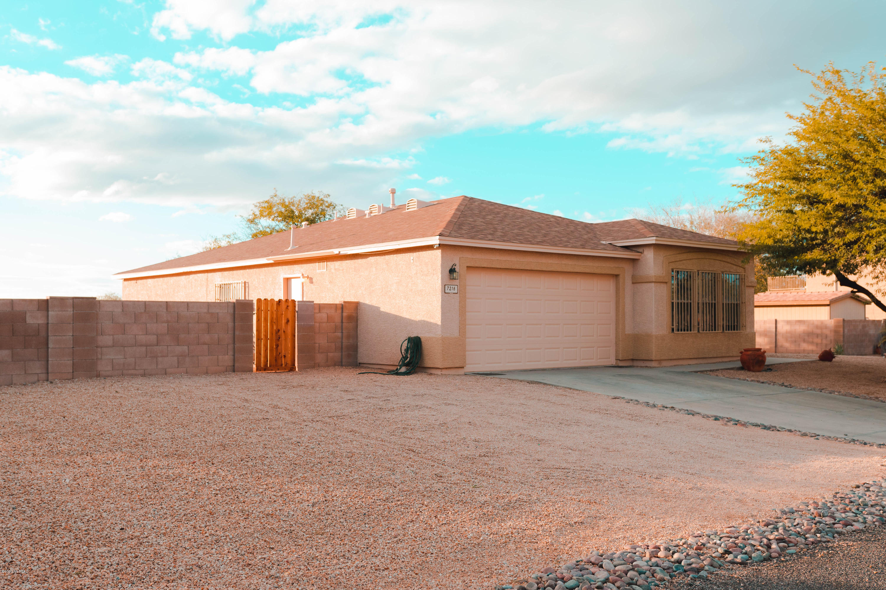 Pride of ownership shows in this well kept 3 bedroom 2 bath home with large den that can convert to a 4th bedroom.  New roof!  Large .4 of an acre with about 60 feet between neighbors. Peaceful wash in the rear of the property; not in flood zone. Large garage for all your toys and a double gate for your RV.  Dog run on the side of home. Quiet community and enough room for a growing family.  Come see this home today and make an offer.