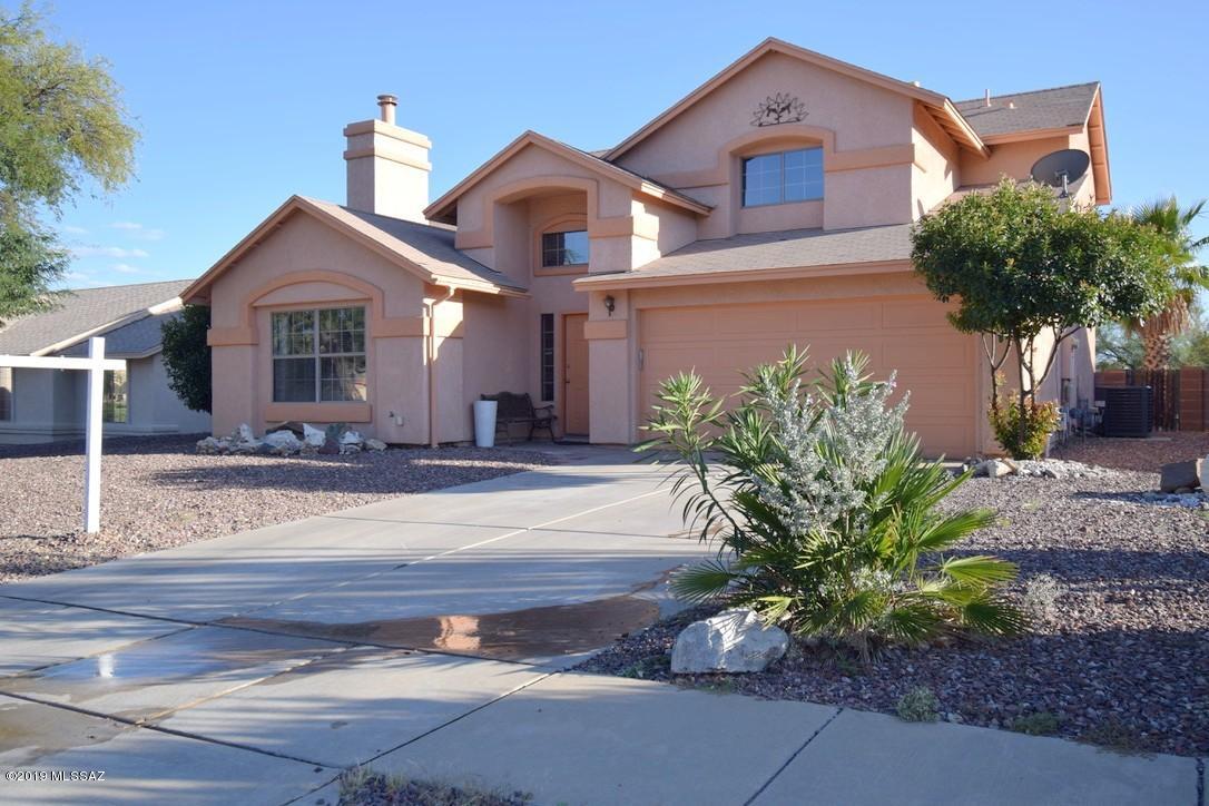 Come see this charming 2 story home with 4 bedrooms, 3 baths, 2 car garage and a breathtaking backyard! As soon as you enter the home you are greeted by the family room with cathedral ceilings and tile flooring that will carry on throughout the first story and the bathrooms upstairs. Right off the living room is the kitchen complete with rich, dark cabinets, stainless steel appliances and a breakfast nook with large windows looking out to the backyard.  The master bedroom is an ideal sanctuary with an ensuite complete with dual sinks, jetted garden tub, and a private balcony that overlooks the oversized backyard that you will never want to leave. An expansive paver patio extends outward to the  captivating pool with waterfall that is surrounded by decorative gravel and turf PLUS unobstructed mountain views! This one won't last long call and schedule a tour today!