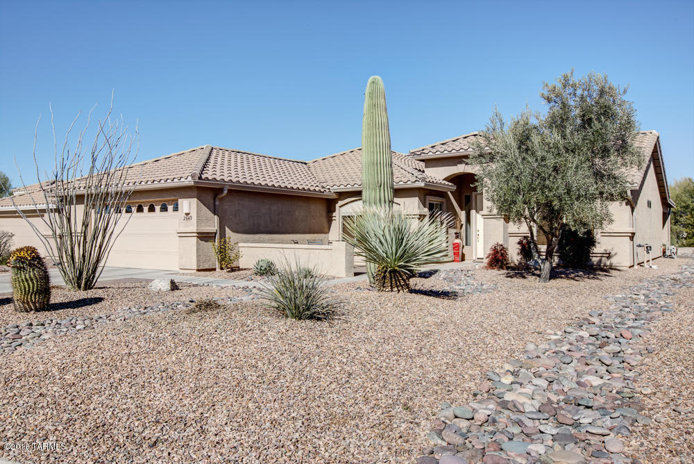 This expanded Laredo has it all!   Newly updated with a designer's magic touch, it is located on a quiet street with mature landscaping and is move-in ready. Many upgrades made approximately one year ago include remodeled master bath shower and granite counter top, new carpet in both bedrooms and freshly painted throughout.  A custom master bedroom closet and new light fixtures are just a few of the extras.   The main living area has 18'' tile and bedrooms have new carpet, designer paint colors in a neutral tone and updated built-ins.  Stainless steel appliances with a gas range.  If that's not enough, surround sound is an added bonus, plus 2x6 construction. Mountain views from front patio.  Expanded garage with built-in storage.  Square footage provided by former owner. Buyer to verify.