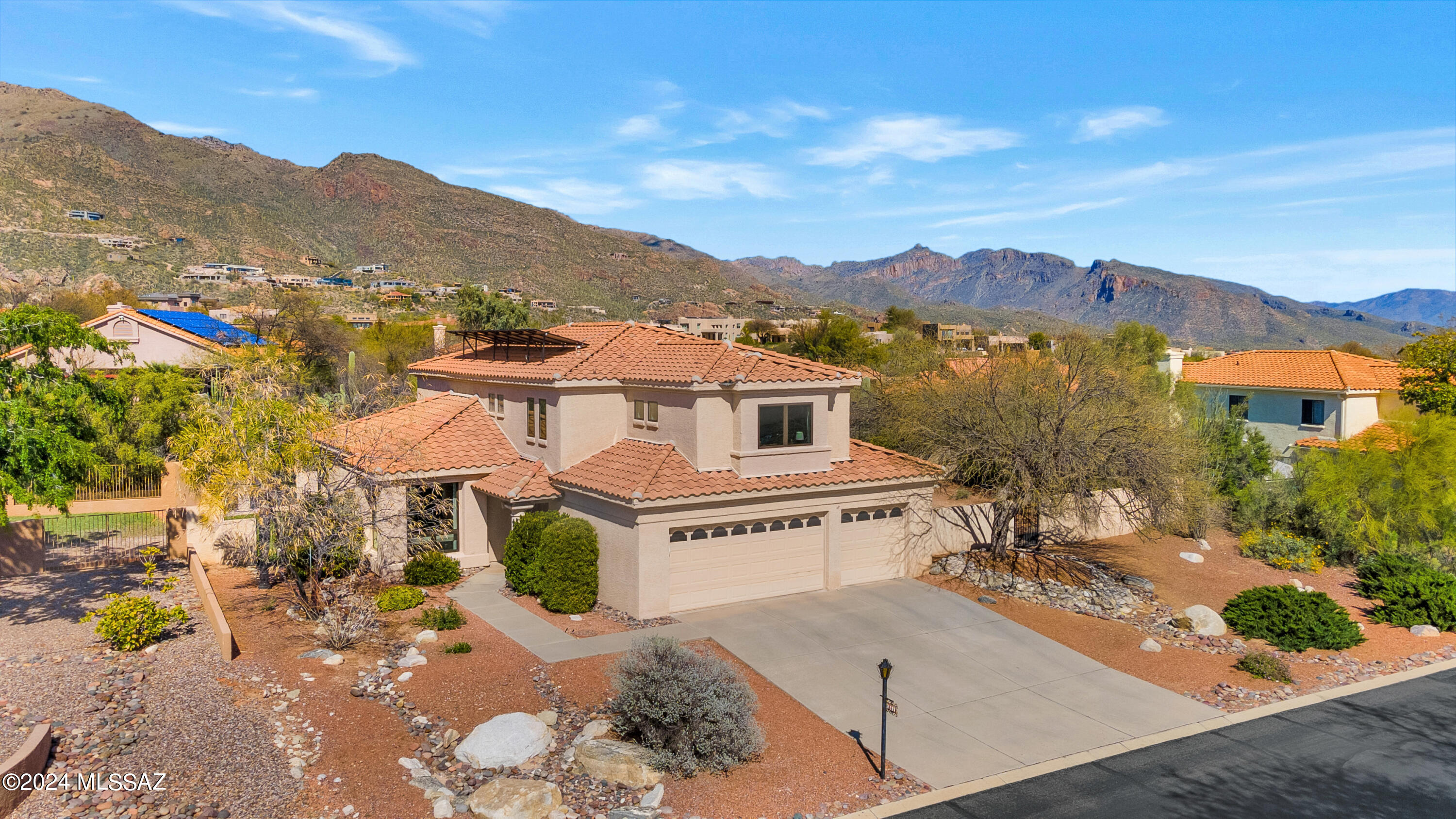 Sellers will entertain offers between $819,000 and $849,000. This stunning residence is nestled within the highly sought-after Casas de Ventana community and features 5 bedrooms and 3 baths. The living room is bathed in natural light, accentuated by vaulted ceilings that create a welcoming atmosphere. Opening to the outdoors, the formal dining room leads to a spacious backyard with a heated pool and spa. Convenience is offered with a main level bedroom en-suite, while the second-floor primary suite boasts a balcony overlooking the Catalina Mountains. Three additional bedrooms are situated on the second level. Additional amenities include a 3-car garage, owned solar panels, new windows, and new AC units. Located close to the walking/biking path to Ventana Vista Elementary School.