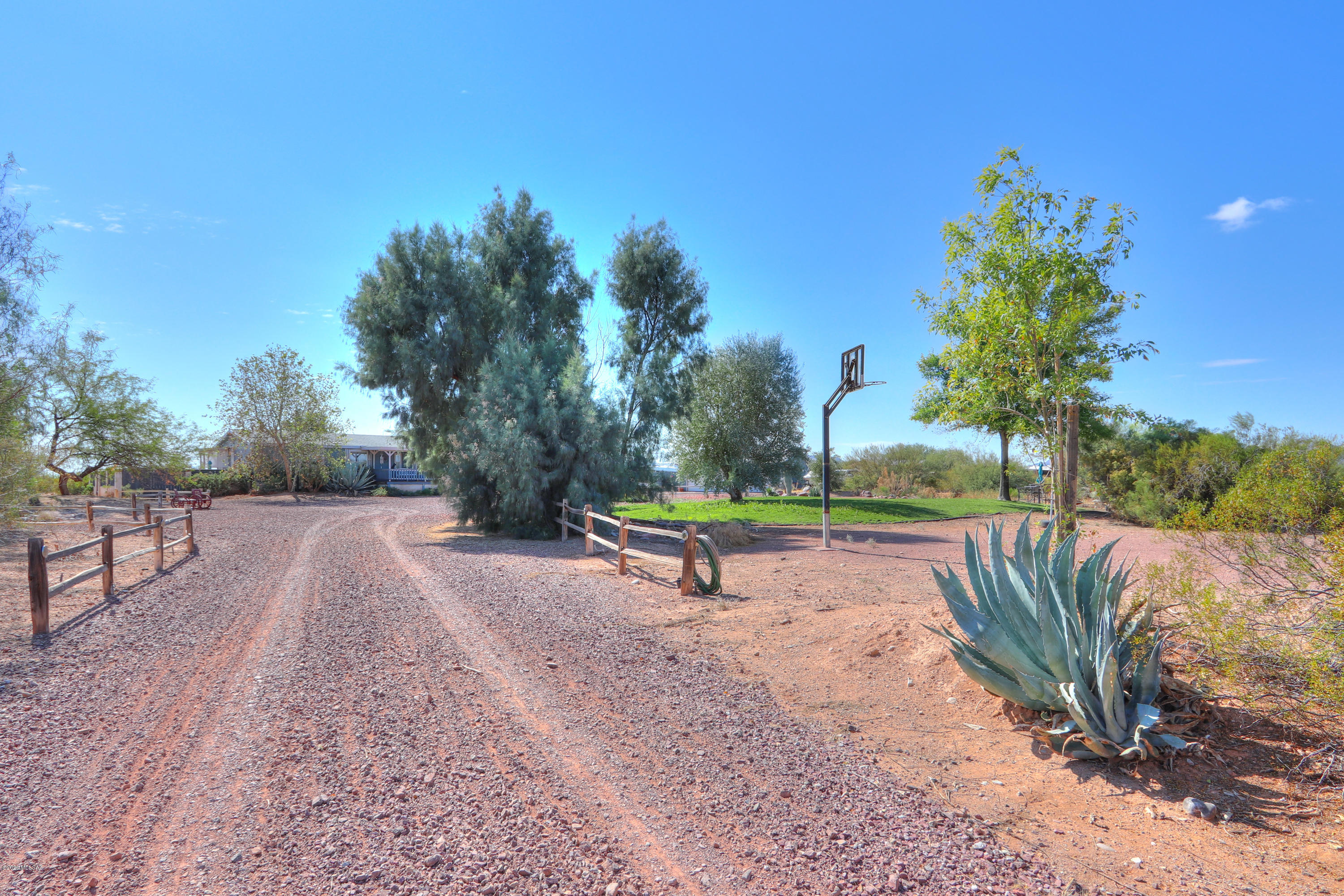This 4 bedroom 2.5 bathroom split floor plan home with a detached 3 car garage w/220V electric sits on over 4 acres of great horse property with amazing views. Lots of updating throughout the house, 2'' faux wood blinds, NEW water heater, 2-year new A/C unit, BRAND NEW ROOF in 10/2019. Remodeled kitchen with a beautiful stone backsplash, new appliances, a farmhouse sink, easy close cabinets with slide outs and freshly painted interior.  Small fruit tree orchard in the back. Irrigation in front and back yards, irrigated garden area and an enclosed yard for your pets. Plenty of room for your toys, ATV's and livestock. Hiking trails and dirt roads nearby. Horse facilities include a round pen, Turnout, 2 shade stalls and a 10 X 16 barn with a loft. Fantastic Property.  Draperies DO NOT convey.