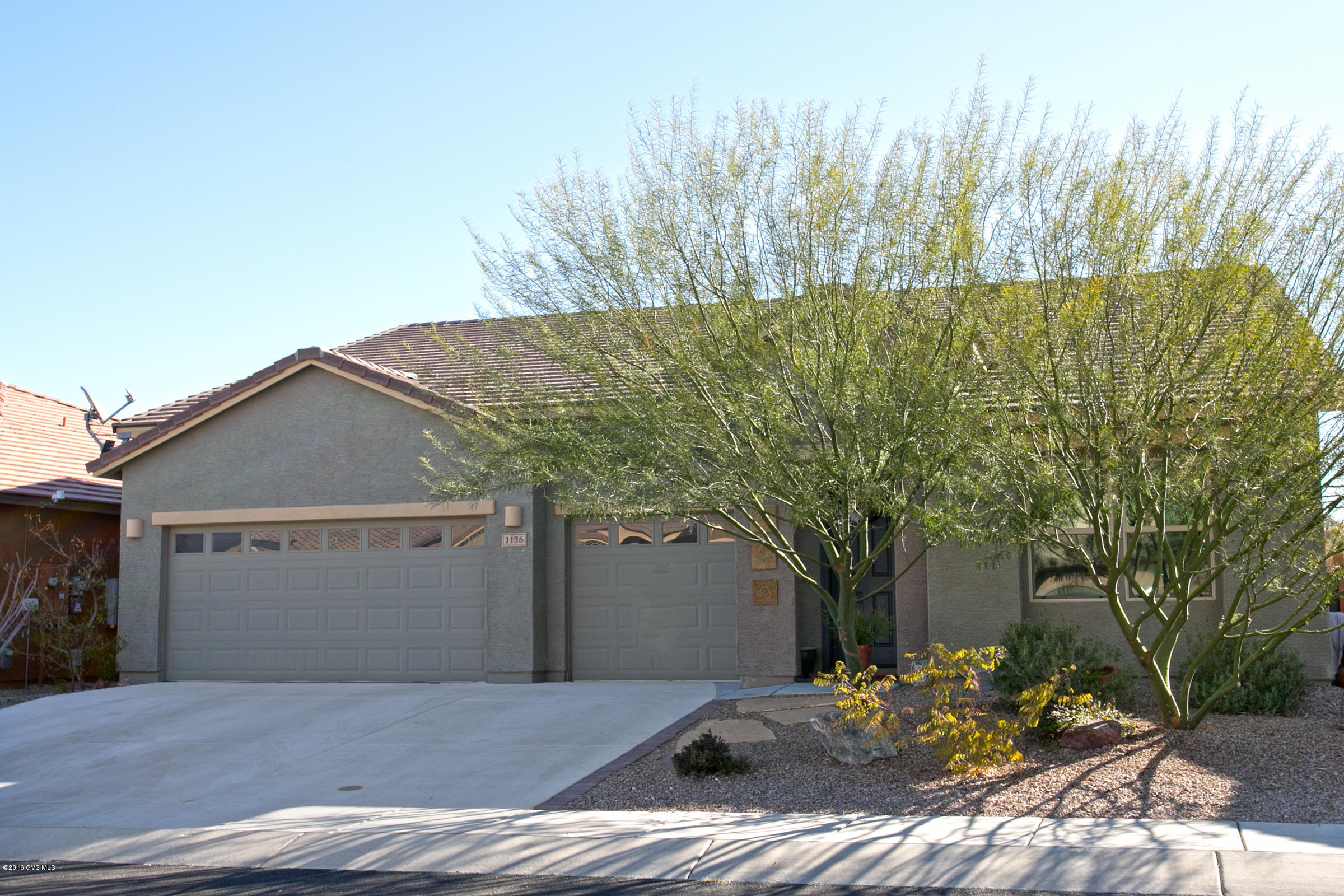 MOUNTAIN VIEWS and NO REAR NEIGHBORS in this like NEW MATICULOUSLY maintained home!!! Lot backs to common area. Many UPGRADES including water softener, reverse osmosis water filtration system, epoxy painted garage floors, ceramic tile through out most of home except bedrooms and den area, granite kitchen counters, espresso colored cabinets, glass pendant lighting over kitchen island area, stainless steel appliances, blinds and ceiling fans throughout, outdoor brick paver patio extension, grass turf area, kids play set, and outdoor fire pit. Floor plan boasts 4 bedrooms, 2.5 baths, GINORMOUS kitchen/great room area, separate den and formal dining area, and 3 car garage!!! Don't MISS this ONE!!! GORGEOUS!!!