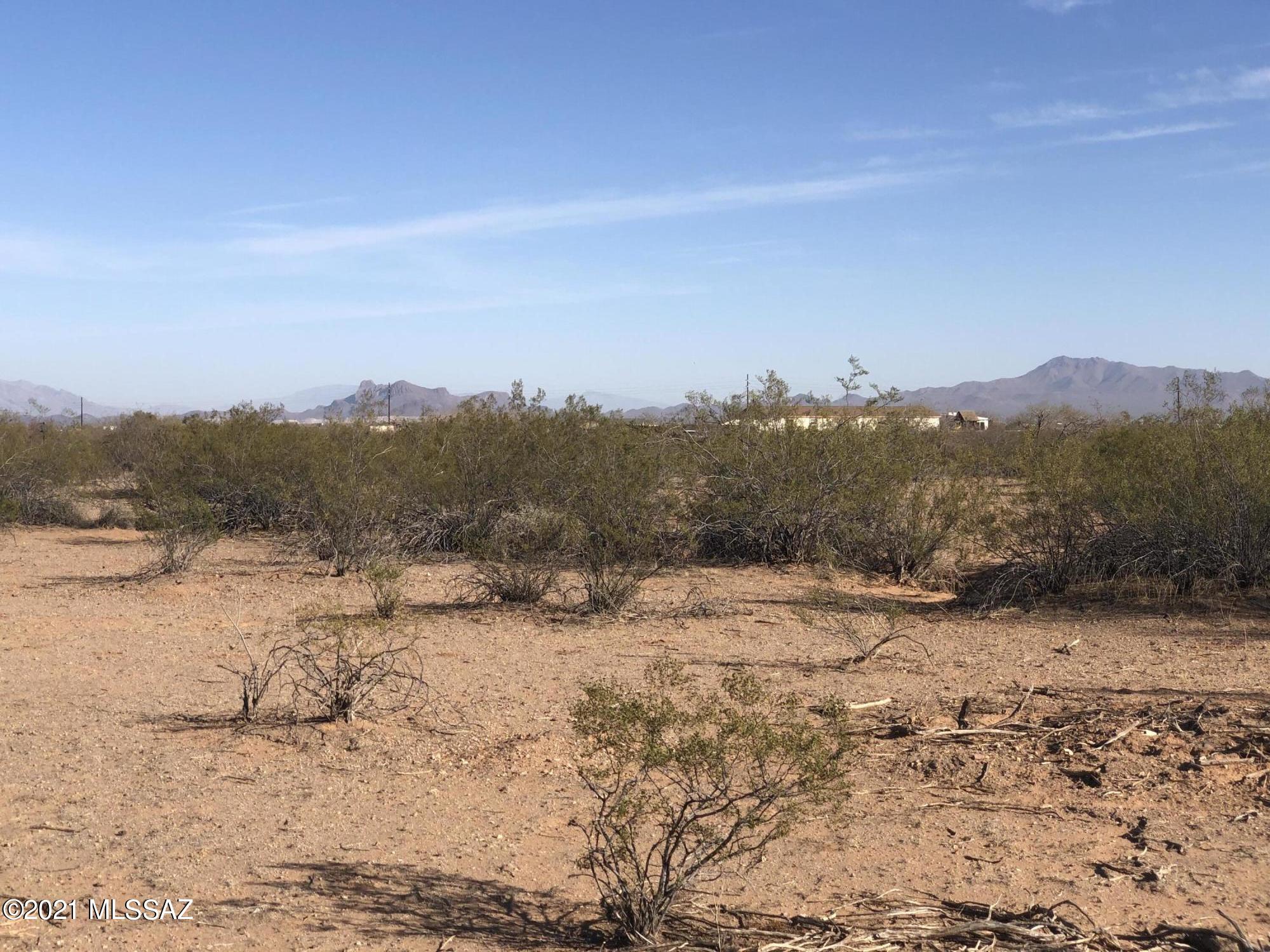 Want the peace and quiet of a rural life? This beautiful flat lot is ready for you to build on or put a manufactured home on and already comes with a septic. The lot south of this one (18000 W. Husker Lane) is also for sale and can be bought together. You then would have an 8.26 acre parcel! Escrow will be with Title Security, Marcia Cormack, 520-219-6451, as title work has been completed.