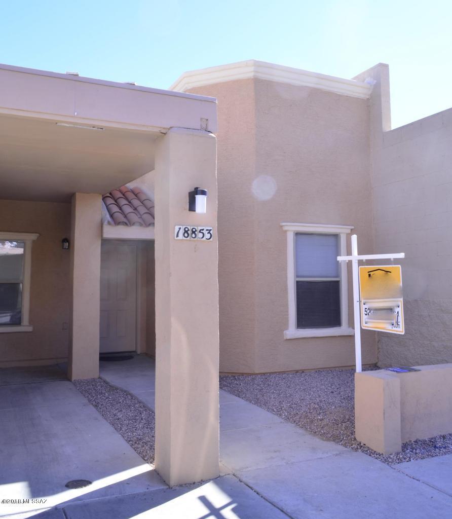 Super cute and very clean 2 bedroom, 2 bath home in the Santa Rita Villas. New carpet, new paint, stainless steel appliances, washer and dryer included, no rear neighbors, and mountain views. There's a nice neighborhood clubhouse, with a pool and spa. Close to shopping, restaurants, schools, and easy freeway access. Bus stop right around the corner for Sahaurita Schools. NOT AN AGE-RESTRICTED SUBDIVISION!!!