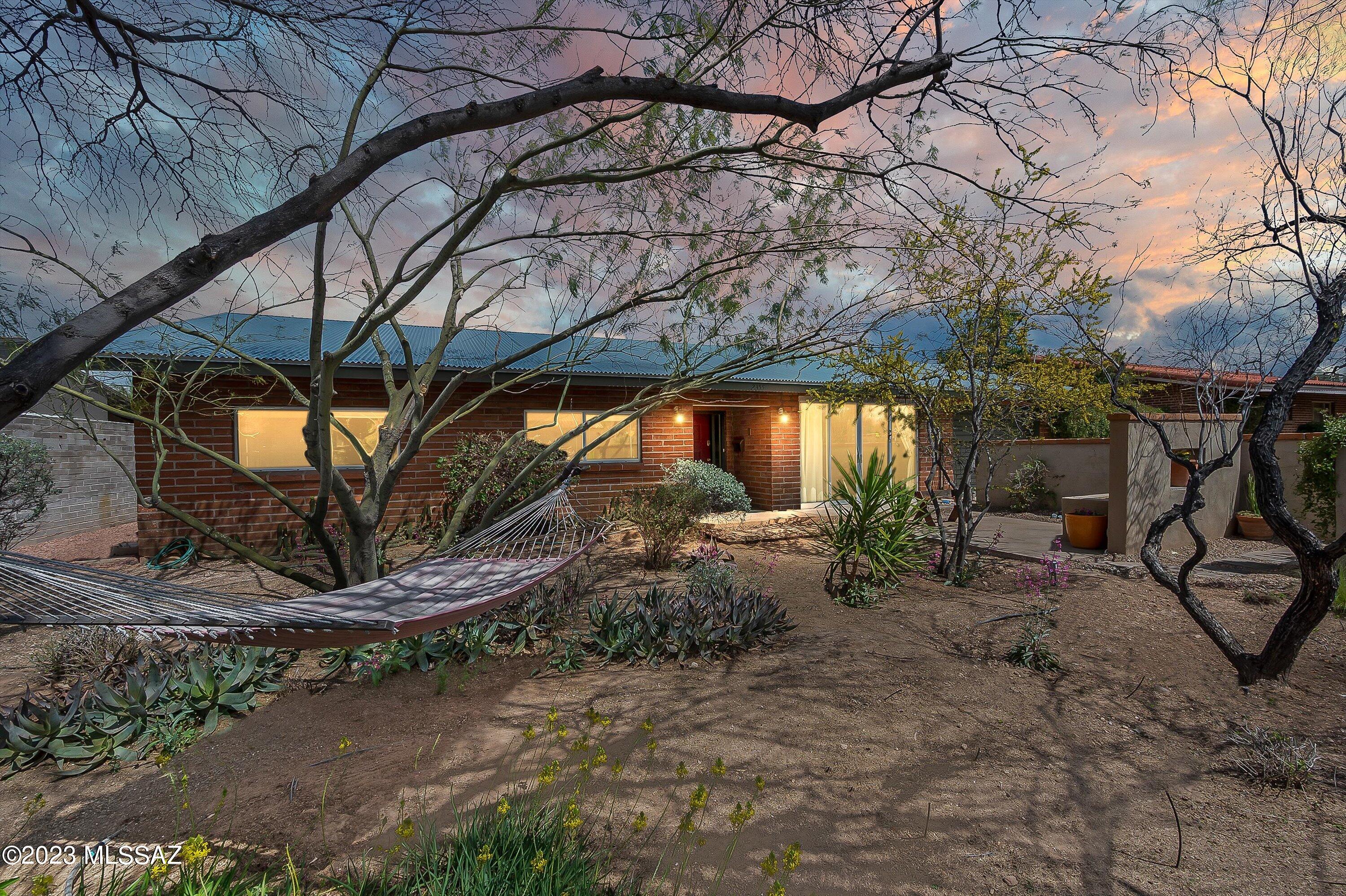 Open, bright and tranquil home in the heart of Tucson. Well loved and maintained. Three bedrooms plus a bonus room and 2.5 baths. Bamboo floors throughout. Floor to ceiling glass doors that open from the family room to the backyard. Front yard and backyard feel like your own private oasis. This is a MUST SEE home! Close to the UA, Banner, Shopping and Restaurants!