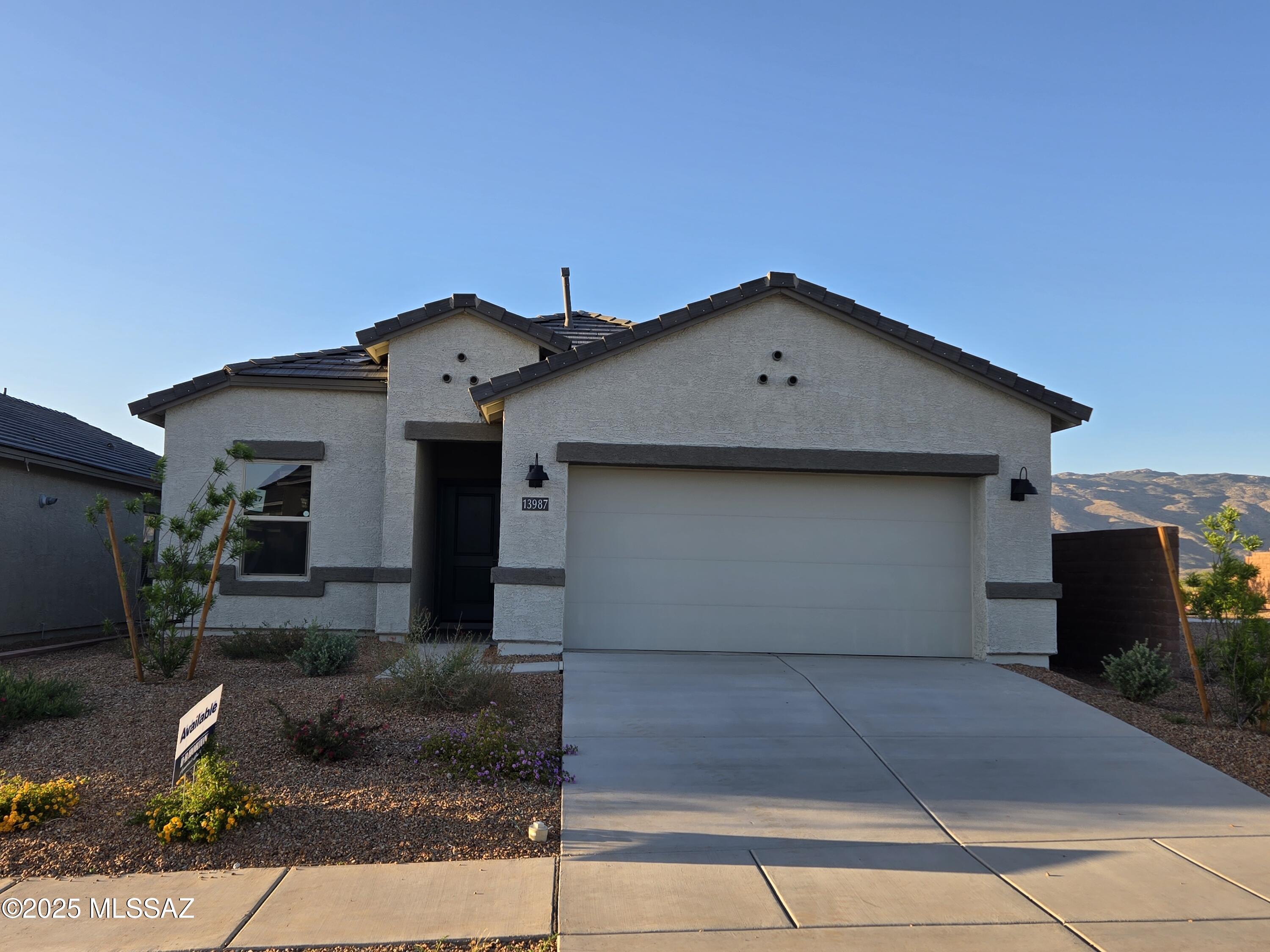 Brand-new construction within Rocking K, a master-planned community. This single-story home boasts an array of sophisticated features that cater to comfort and style. The living area is accentuated by 9 feet high ceilings. Quartz countertops in kitchen and bathroom, shaker style cabinets, wood look tile, plush carpeting in bedrooms plus stainless steel appliances including a microwave, dishwasher and gas range. The primary suite has a large closet for ample storage and a en-suite bathroom with a double vanity. Energy efficiency is at the forefront of this home's design, boasting dual pane low-emissivity windows and ceiling fan prewires to ensure comfort year-round. A 2-car garage provides convenient parking and includes outlet for electric car charger. Come see this home today!