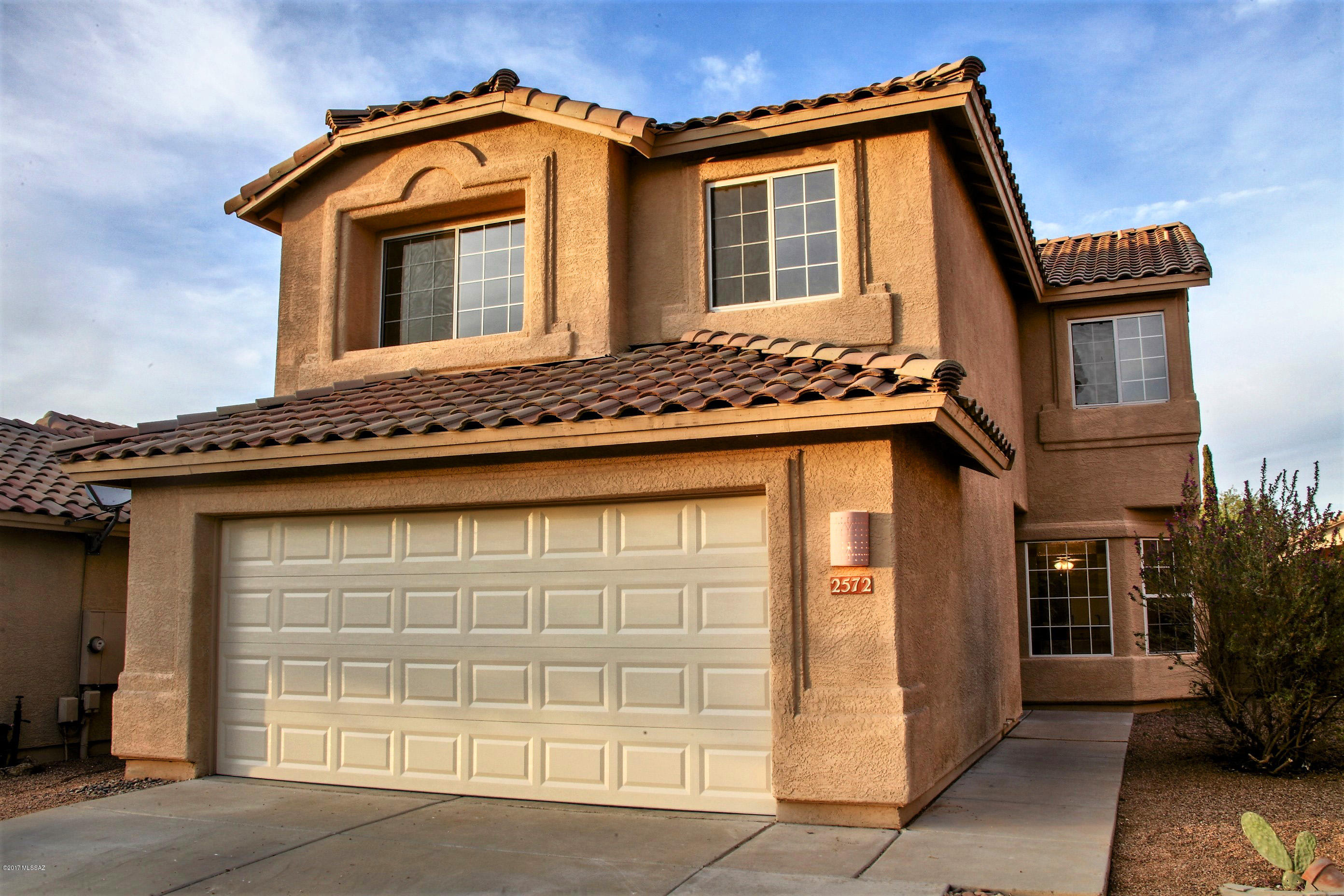 Spacious floorpan with updated kitchen, granite countertops, and tile. New carpet, newer A/C (2 years young), and great backyard patio. All bedrooms are upstairs. New water heater and garage door. Move-in ready!