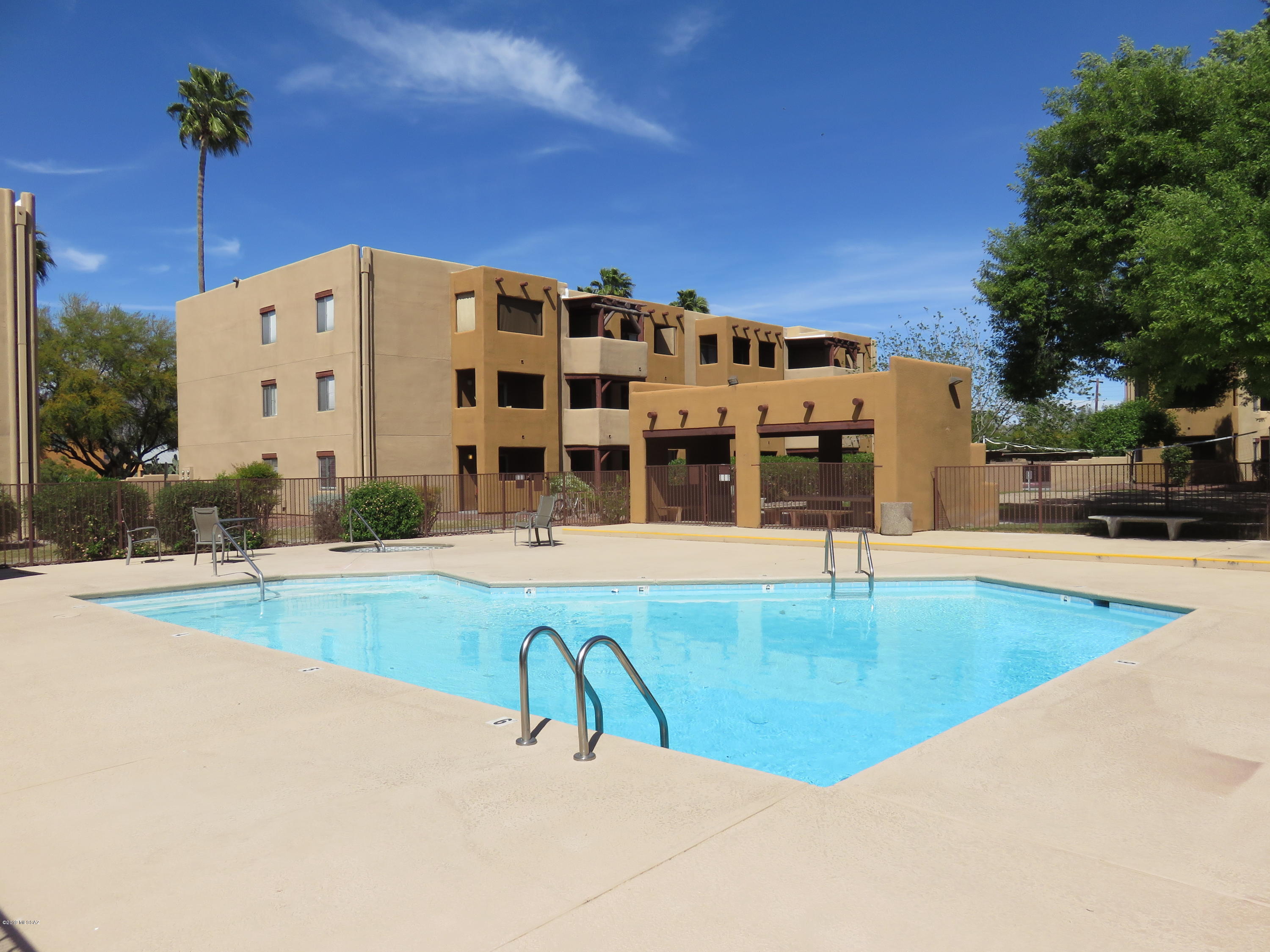 Don't miss out on this private central Tucson condominium! This move-in ready newly updated ground floor condo has new tile and fresh paint throughout, new fixtures, and much more. This convenient location is close to shopping and restaurants while just minutes from the University of Arizona. The clubhouse has an exercise room, billiards table, racquetball court, tennis court and sauna. Also enjoy the other amenities such as 2 pools & spas and sand volleyball court.