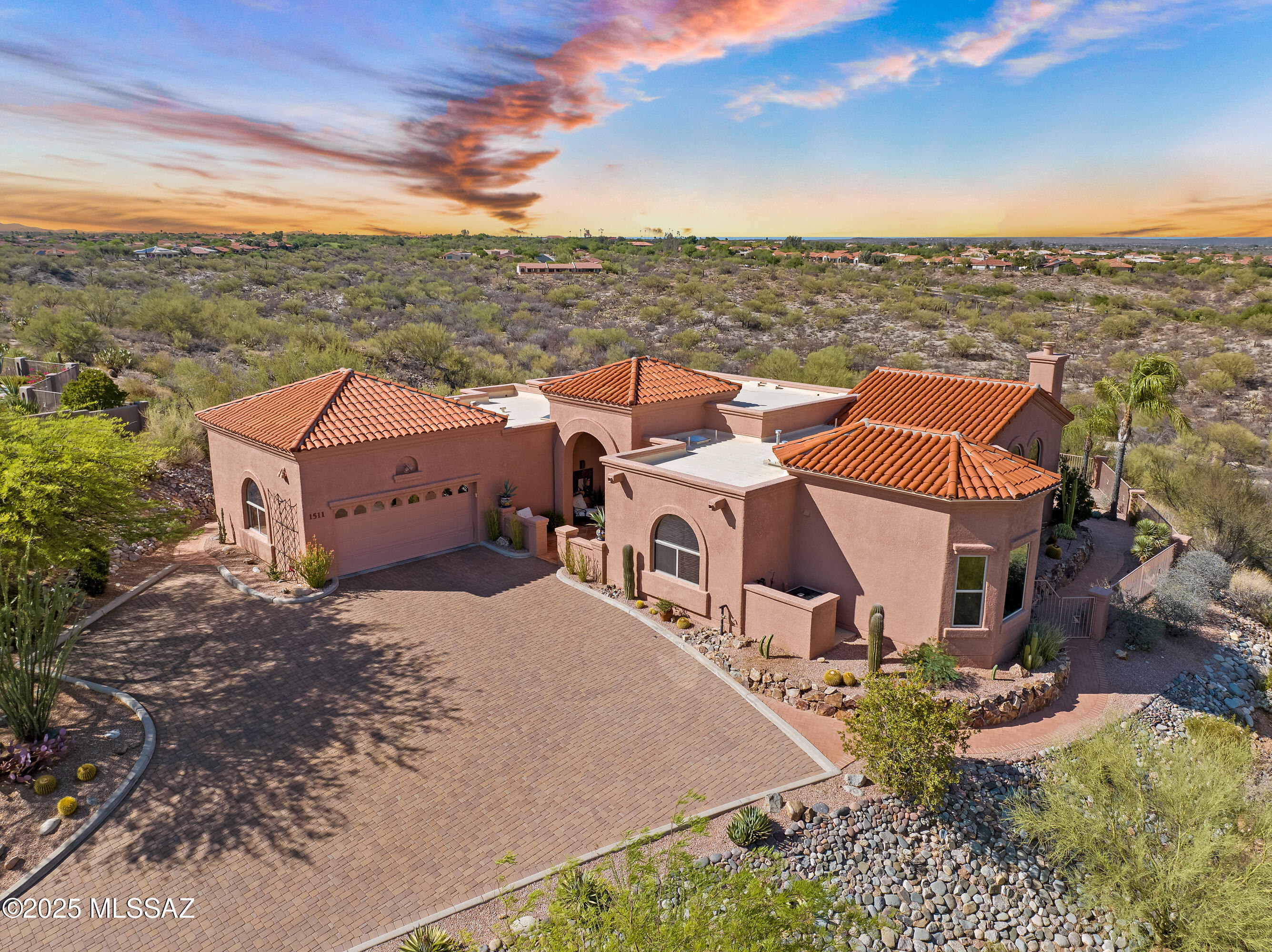 Hilltop Luxury with Panoramic Catalina Views, Smart Upgrades & Outdoor Serenity perched atop 1.22 acres in a prestigious gated Oro Valley community, this 2,515 sq ft home delivers breathtaking, unobstructed views of the Catalina Mountains from its elevated, private lot. Designed for modern desert living, the home's glass wall living room brings the mountains into daily view, while the split-bedroom floor plan ensures privacy and flexibility. A suite of recent upgrades makes this home both stylish and smart. Fully redesigned backyard with lush artificial turf and tranquil fountain. The covered patio with newer fans and lighting are ideal for year-round entertaining. Fresh exterior paint (2024) gives the home a crisp, updated look.One of the seller's is licensed to sell real estate in AZ Extras include WiFi-zoned climate control, smart irrigation system for ease and heat-rejecting window film throughout, energy-saving and sun-smart. You will love the newer appliances, soaring ceilings, abundant natural light and open living areas. Whether you're soaking in the views, enjoying a cool sunset on the porch, or appreciating the ease of smart-home features, this home offers a rare blend of location, lifestyle, and livability.