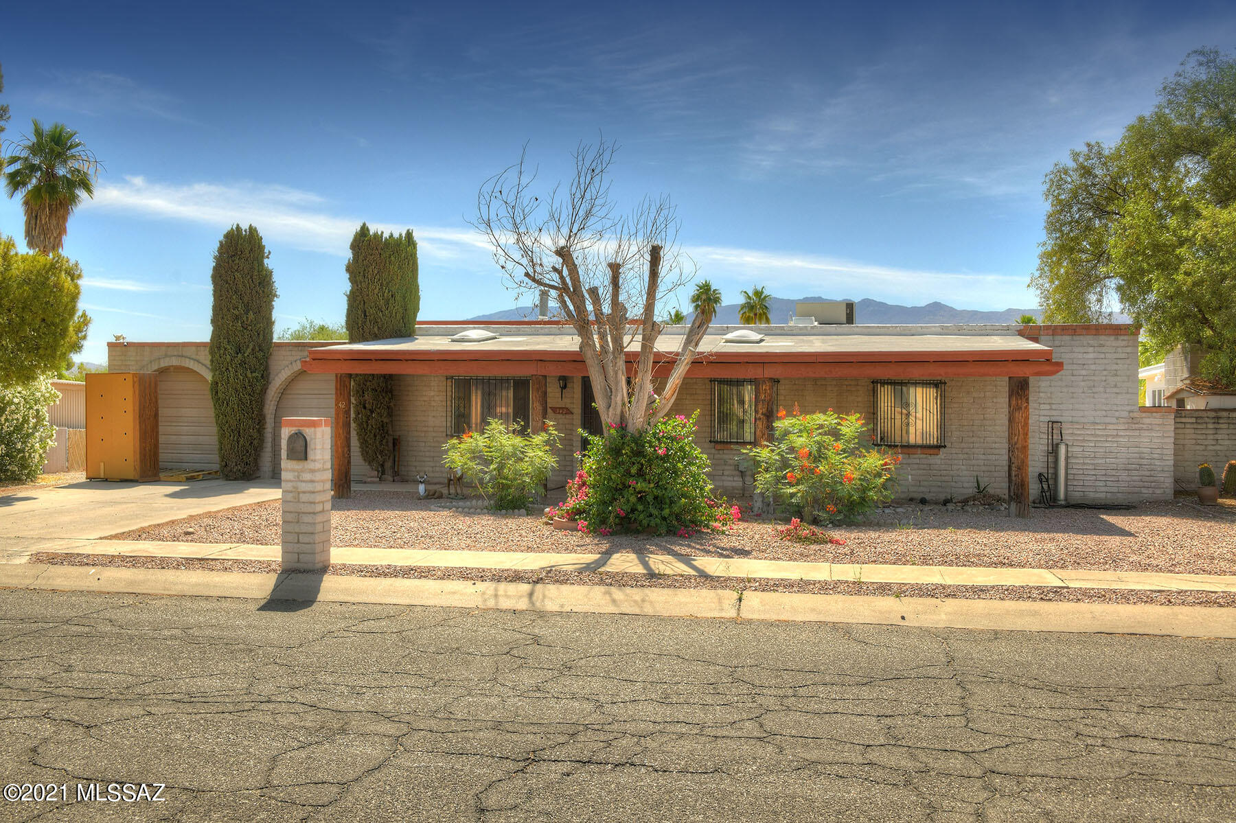 Beautiful, private ranch style home featuring 3 bedrooms, 2 bathrooms, and an additional great room with wood burning fireplace.  Fresh paint throughout. New carpet in all bedrooms and living space.  New ceiling fans.  2 car garage + BONUS oversized garage accessible from the alley through the backyard entering through the automatic sliding gate.  This property shines with potential!!  Mature landscaping in backyard.  Not to mention NO HOA!!!!