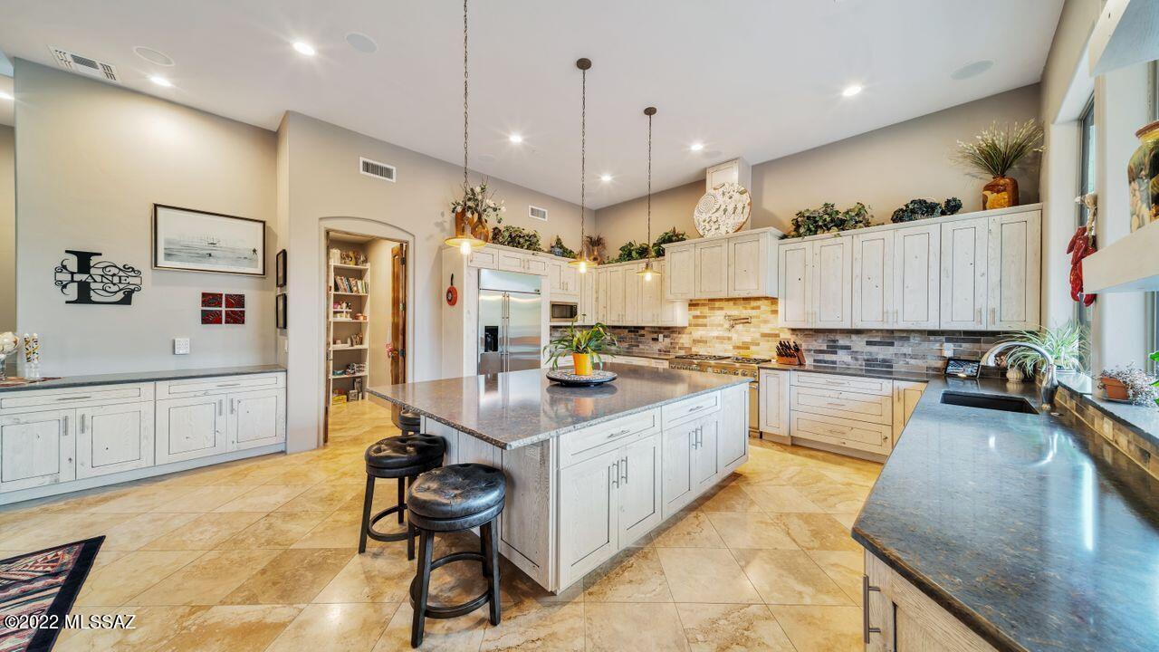 Sought-after Dos Lagos, located on the Gallery South Course ! Large foyer opens to great room w/ trio of arched windows w/ amazing pool & mtn views. Stunningly remodeled kitchen featuring 6' x 9' island w/ seating, 6 burner Thermador 48'' pro grand range w/ griddle & pot filler, Rustic farmstead oak custom cabs, spacious walk-in pantry, wine fridge, gorgeous stone backsplash, huge windows overlooking the outdoor kitchen, mtns.  Double doors lead to your master retreat, w/ room for seating area by windows to take in the view. Dual closets, soaking tub, shower, granite counters. BR 2 has private bath, BRs 3 &4 share Jack&Jill bath. Two level patio has pool, spa, waterfall, gas fire pit. Travertine thru out. 3 car gar, w/custom storage cabinets & epoxy flooring. Call for private showing