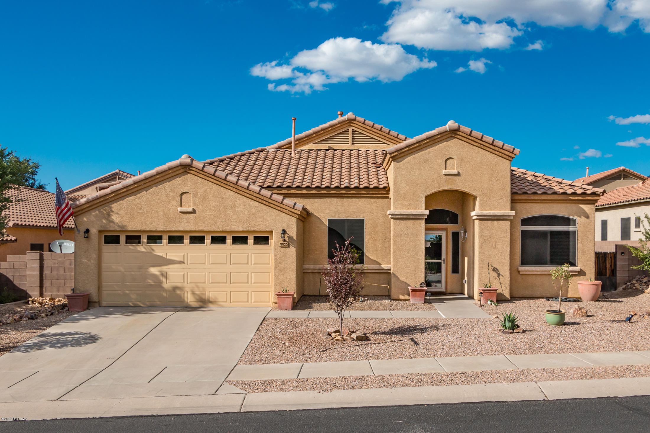 HUGE PRICE REDUCTION! Time is limited! Bring your offer before someone else does on this wonderful family home! BEST DEAL in Dove Mountain!  Beautiful 4 bedroom home in Dove Mountain has great split bedroom floor plan with large living room and separate family room off kitchen & dining area. Gorgeous kitchen is the hub of it all with breakfast bar, maple cabinets, center island, pantry and counter space galore! Huge master bedroom with walk in closet, separate shower & tub and dual sink countertop. Finished garage has overhead storage. The backyard is a delight with pavers extending the patio and mature vegetation.
