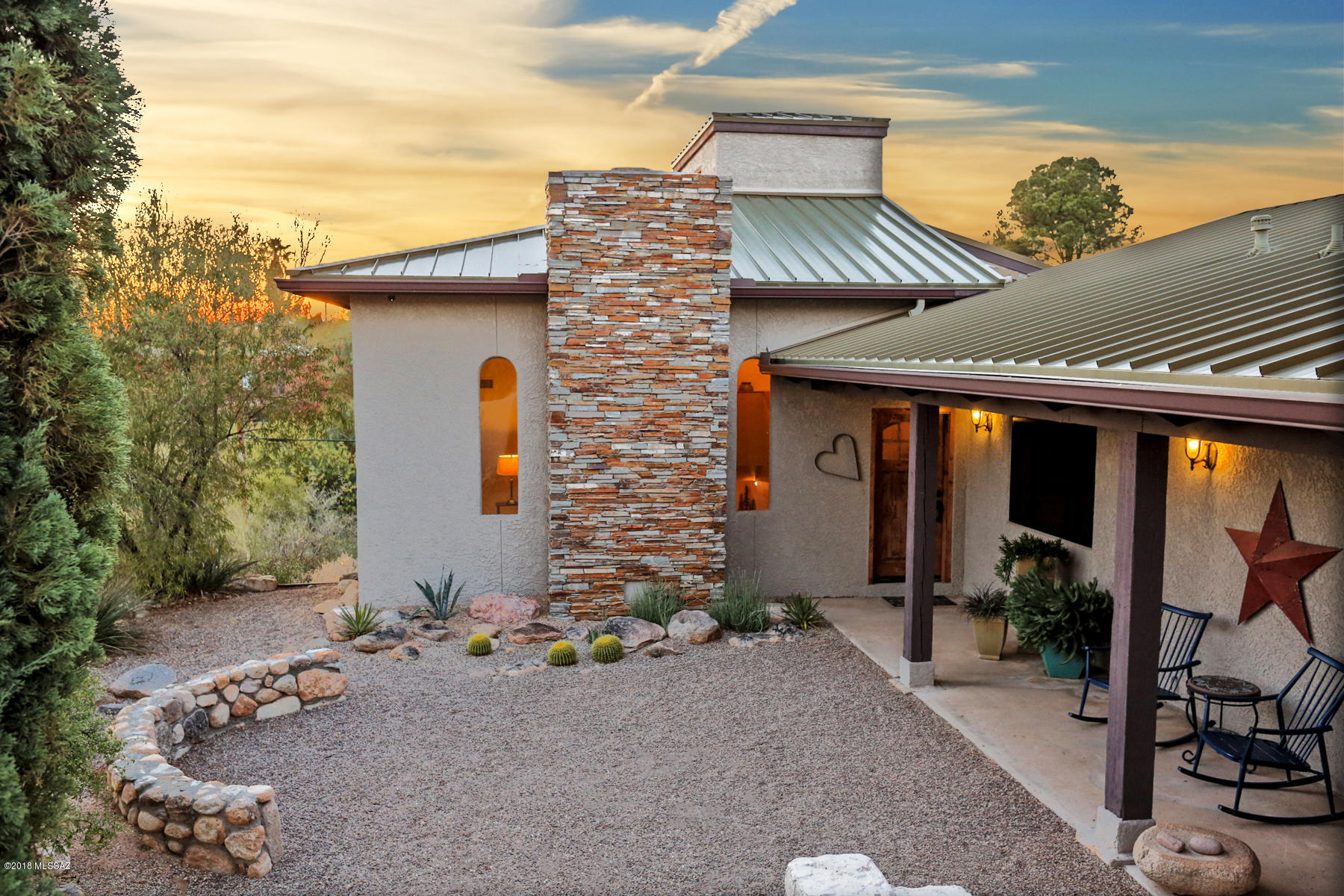 Gorgeous Custom-Built Tri-Level Southwestern Style Home in the Desirable Catalina Foothills Neighborhood. Character & Charm Abound in this Truly Unique Home. Sweeping Catalina Mountain Views from Amazing Patio Decks & Spacious Back Yard.  Enjoy Privacy from the Tucked Away Cul-De-Sac Lot. High 15' Beamed Ceiling in Great Room with Arched Windows, Exposed Adobe Fireplace, Mexican Tile Floors, Formal Dining Area & Breakfast Nook. Remodeled Kitchen Complete with Black Appliances, Quartz & Butcher Block Countertops, Custom Cherry Cabinetry & Santa Teresa Backsplash. Workshop/Garage, Two ''Drive Though'' Covered Parking Spaces, Ample Storage, New Metal Roof with Gutters & 1500 Gallon Rainwater Harvesting Tank. Gorgeous Backyard with Water Water Fountain Feature, Hot Tub & Remarkable Views!