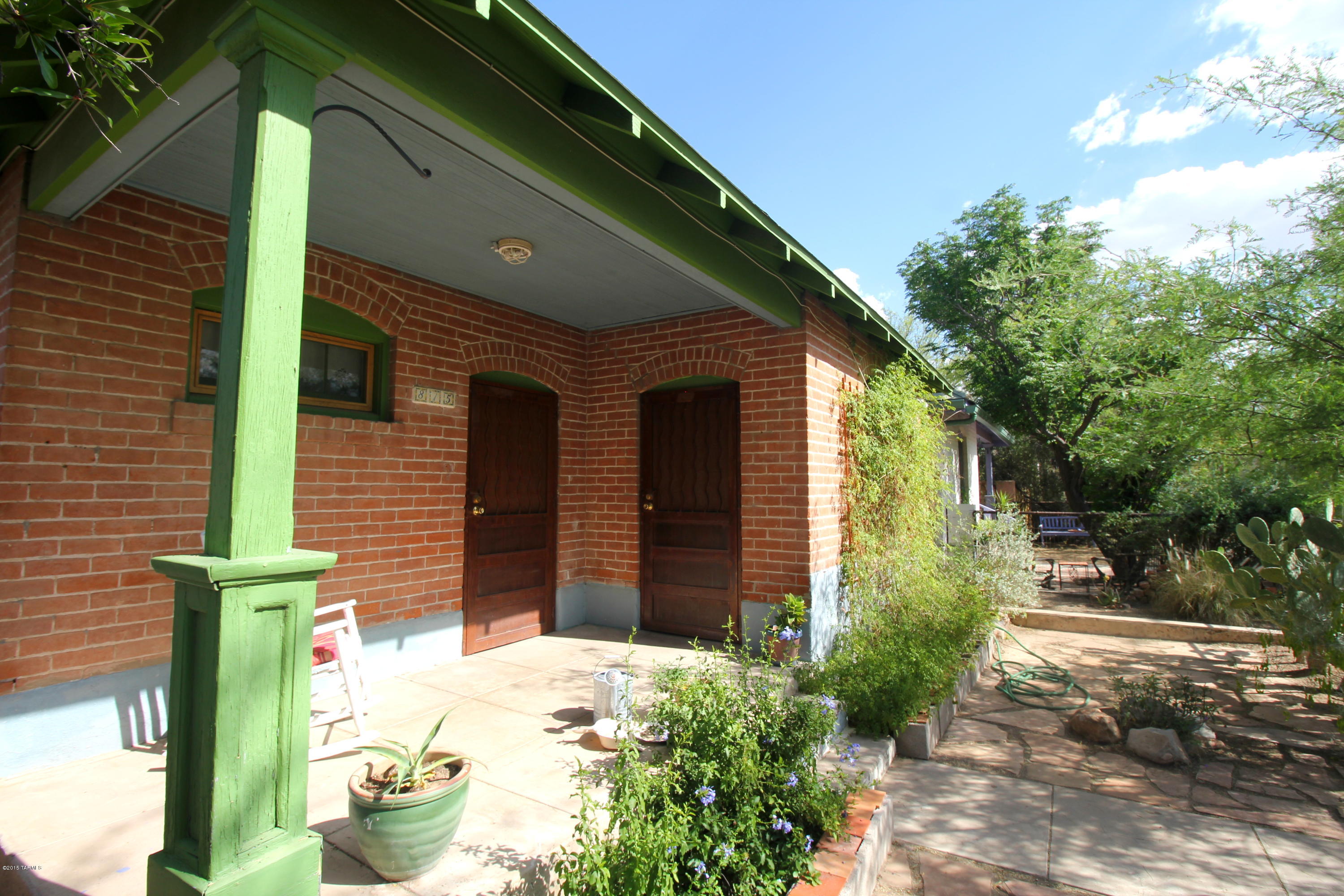 Darling dollhouse in historic Armory Park! Sweet vintage charm, original fir hardwood floors could dazzle with some refinishing, lovely front porch. This home feels light and airy, tucked in with other turn of the century gems. Owner occupiers can qualify for historic tax credit, saving you nearly half annually.  Central AC and heat, spacious eat-in kitchen with built in cupboard, Okeefe & Merritt range/oven, plus a bonus room/office with washer (no dryer hookup), even a doggie door, and a nice-sized backyard, fully fenced! No alley access. With a little love and polish, make this charming house your home, and start your garden!Priced to sell as-is, older plumbing and roof (but no leaks!), and semi-updated electric.