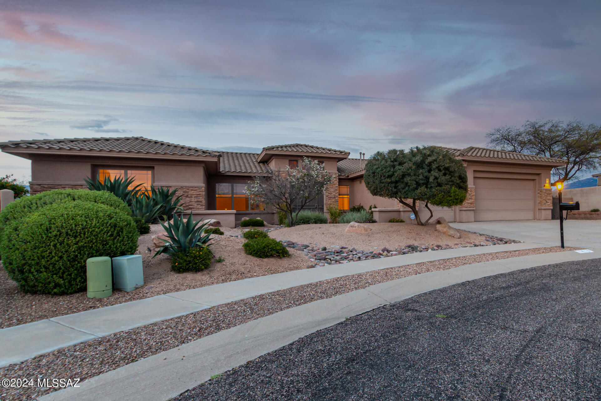 Striking views you will fall in LOVE with! Highly desirable Monument Estates Community. Breathtaking sunsets that sweep upon the mountain views in the oversized back patio while you revel in the genuine Arizona desert landscaping. Captivate your guests in a game of Basketball, pickle ball or just warm up near the firepit while the food is on the BBQ! Why stop there! The .39 acre lot offers room to put in a pool! The exquisite neutral palette allows for your creative touches to make it YOUR home. Upgrades throughout: bathrooms, kitchen, flooring and backyard. Expansive primary bedroom has remarkable mountain views and an updated en suite, deep soaking tub, separate shower, large closet and dual vanities. Split floor plan includes additional bedroom with en suite and walk-in closet. Showboat your gourmet chef skills in the kitchen with stainless appliances, wine refrigerator, granite countertops, a center island kitchen that flows into the great room and breakfast nook. Ample 3 car garage with generous storage. Don't miss this rare opportunity to own this meticulously cared for home close to shopping, schools and all amenities at your fingertips.