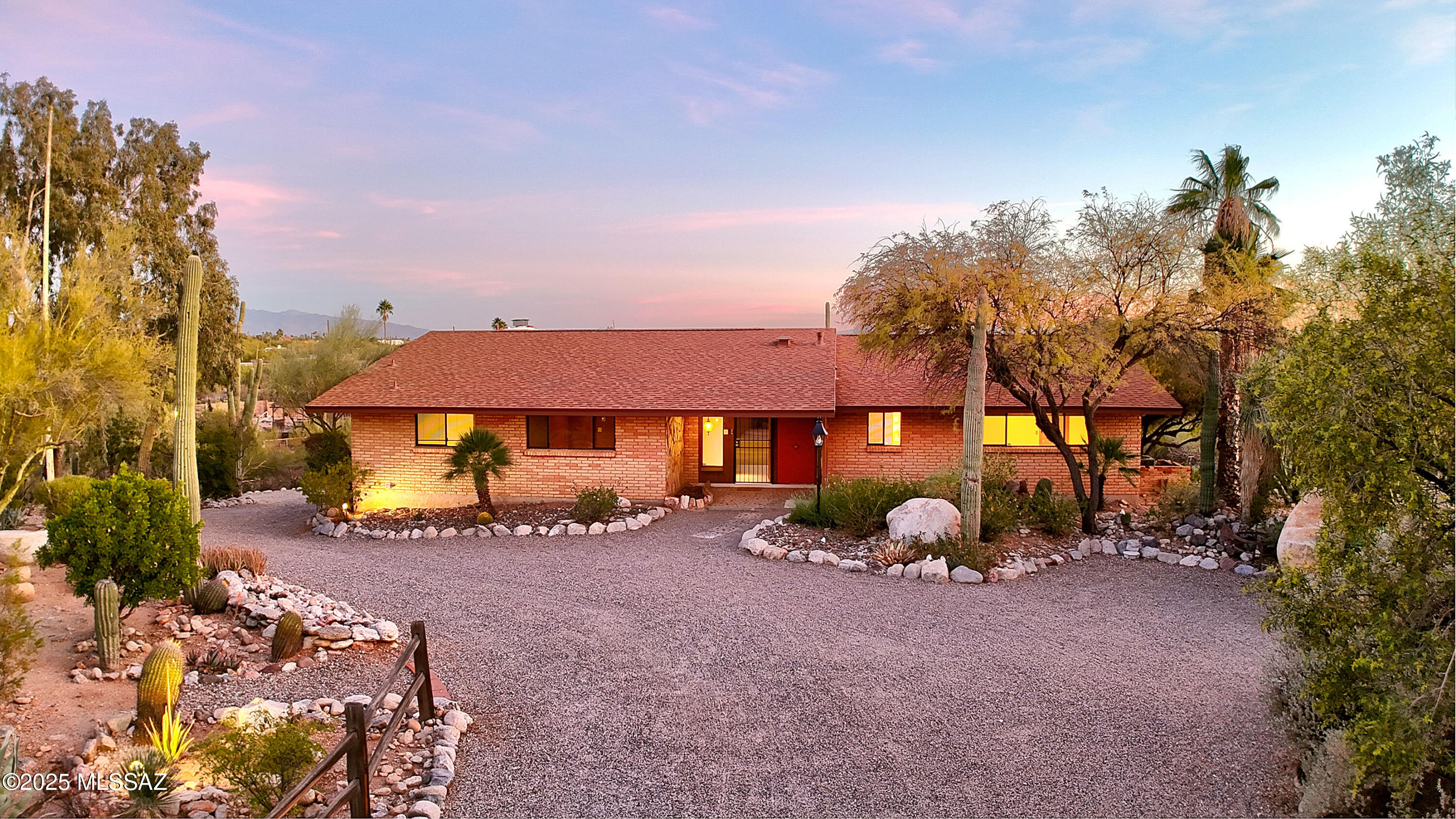 Discover the classic charm of this mid-century home w/amazing city & mountain views. Entry foyer w/stone wall sets the tone & leads you to the light-filled living room w/picture windows framing the scenery.  Retro kitchen flows into the oversized fam rm w/lots of built-ins & a cozy corner FP. Terrazzo floors enhance the vibe and the outdoor living is fantastic w/sparkling pool, hot tub, flagstone deck & space for entertaining. Primary Suite has a FP, dual sinks, walk-in shower & lg closet. Lovely cedar coat closet by 2nd BR & 3rd BR has built-in storage + desk. Lower level features hobby rm, 3/4 bath, 2-c gar & xtra lg storage. 1 BR Gst Hse is 880 SF w/wrap-around patio, kitchenette, spacious liv rm + more storage. This home is a great opportunity to create your mid century modern vision.