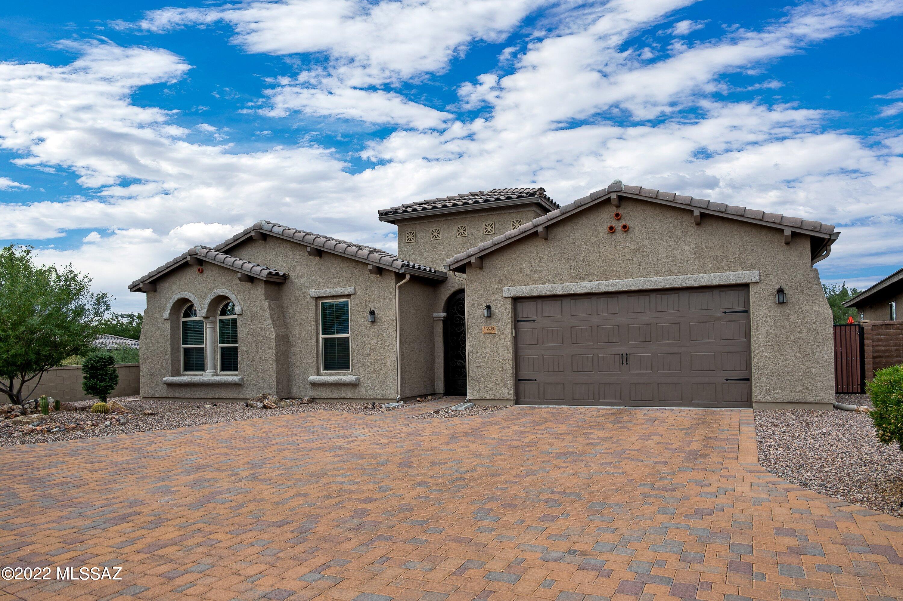 Striking, highly upgraded 4BR/3BA (3,081 sq ft) gated home at Center Pointe Vistoso offers Catalina & Tortolita views and backs to the Vistoso Trails Nature Preserve for privacy. Brick paver drive/courtyard flow to large gathering room with porcelain plank tile and 10' ceilings. Gourmet kitchen w/breakfast bar & nook affords countless amenities. You'll also enjoy a formal dining room, den/office + media room. Split bedroom plan hosts an extended Owner's Suite w/luxury bath & huge walk-in closet. Also featured are tray ceilings, plantation shutters, ceiling speakers and 3-car tandem garage. Travertine tile highlights the rear covered patio & yard w/BBQ station, firepit, turf area, citrus trees plus block & view fence. Center Pointe Park offers a clubhouse, pool/spa/splashpad and playground.