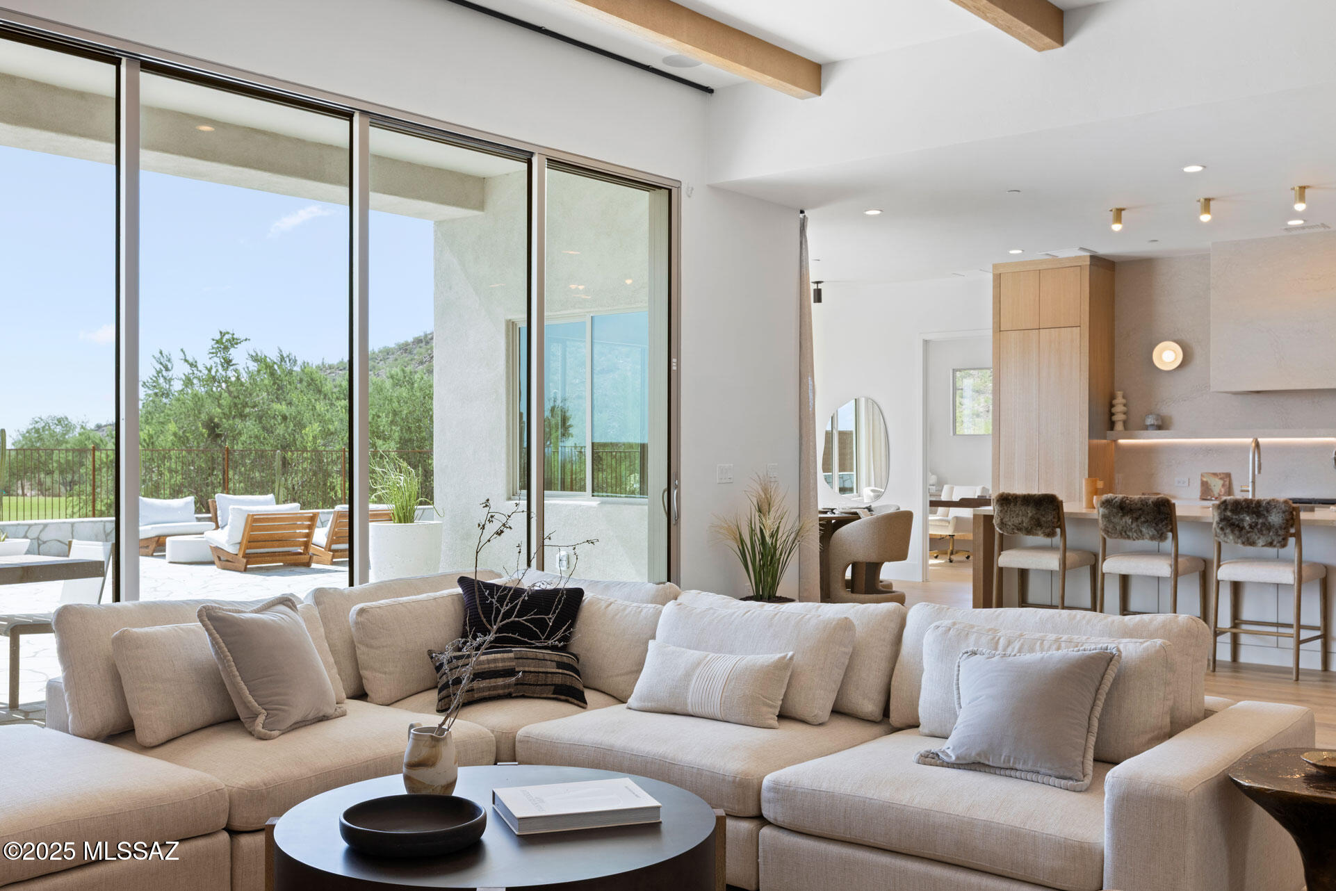 MODEL LEASEBACK OPPORTUNITY. Discover a professionally designed 3-bed, 3.5-bath model home in the gated Boulder Canyon community by Fairfield Homes, located in Dove Mountain. This serene desert sanctuary offers city and mountain views within a premier golf course setting. The heart of the home is a thoughtfully designed kitchen with a chef-inspired layout and an expanded butler's pantry for prep, storage, & seamless living. Soaring ceilings & expansive living areas with a fireplace, while a dedicated study and separate den are ideal for work, relaxation, or quiet retreat, with flexibility to adapt to your lifestyle. The luxurious primary suite features a spa-style bath and walk-in closet. Enjoy a private backyard with a covered patio & pool. Quiet. Serene. Exclusive. Discover a true desert sanctuary in the exclusive, gated Boulder Canyon community by Fairfield Homes, nestled inside prestigious Dove Mountain.
This 3-bedroom, 3.5-bath luxury home, masterfully designed and decorated by a professional interior designer, combines elegance, functionality, and tranquility in one of Southern Arizona's most coveted locations.
From the moment you arrive, you'll be captivated by the dramatic desert landscapetowering saguaros, striking rock outcroppings, and endless desert vistas that create a breathtaking natural backdrop.
Perched in the Tortolita Mountains within a premier golf course community, the home offers a rare sense of peace and privacy, complemented by sweeping city and mountain views.
Inside, the design invites both comfort and sophistication:	Expansive Living Room with soaring ceilings and walls of glass for natural light and desert views.
Chef's Kitchen with butler's pantry and extensive storage, tailored for entertaining and everyday living.
Bonus Spaces that flex effortlessly to your lifestyle needswork, play, or relaxation.
Outdoors, serenity takes center stage. Enjoy quiet mornings on the covered patio, savor the stillness of the mountains, and watch as the desert sky transforms with every sunset.
As part of this exclusive enclave, residents may also access private membership benefits through Fairfield Homes partnershipsa lifestyle privilege that extends well beyond the home itself.
Quiet. Serene. Exclusive. This is more than a residenceit's the luxury desert lifestyle redefined.
