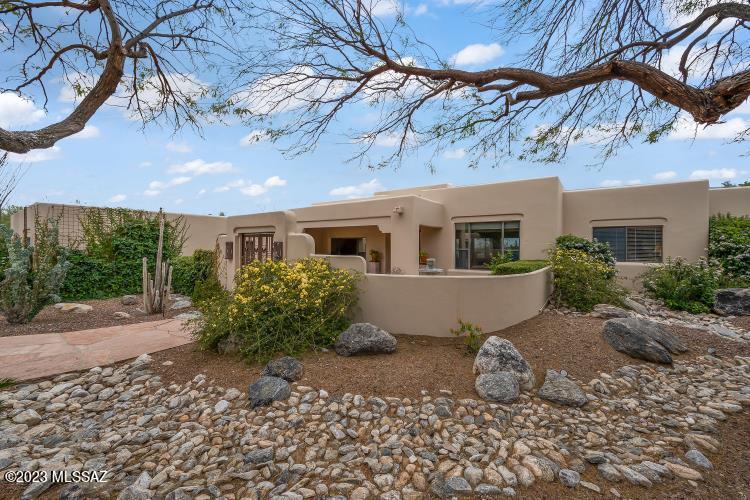 This custom 3 BR plus Den home boasts stunning views on the 4th Green of the Ventana Canyon ''Canyon'' Golf Course, mountains, and city. A gated courtyard entry with a covered patio and fountain, welcome you to the property. The living areas are light and bright. The floors are travertine, adding to the home's luxurious feel. Large glass sliders lead to the backyard, which is a perfect place to relax and entertain. The backyard features a pebble tec pool and spa, a firepit, a grassy area, and a covered flagstone patio. Enjoy the breathtaking views from the pool or sitting around the firepit. The split bedroom plan provides privacy and comfort.  The circular concrete driveway leads to a 3-car garage with epoxy flooring and storage, providing ample space for your vehicles and storage needs.