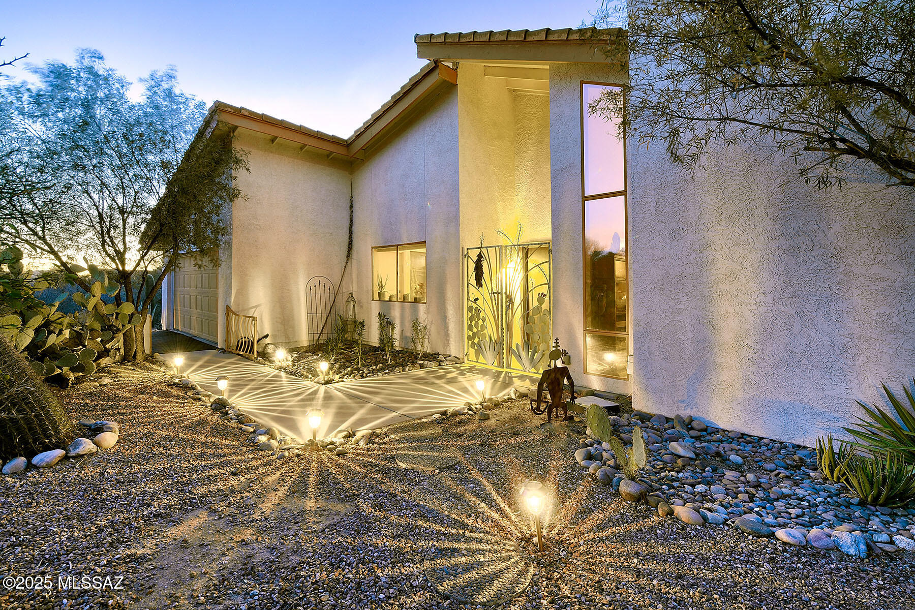Charming single story .62 acre home nestled in the heart of the Catalina Foothills with Santa Catalina Mountain views. Relax in the large living space with wood burning fireplace & ceramic tile floors throughout. The dining area is located adjacent to the kitchen & has a wet bar with custom hand painted tiles, convenient shelves & cabinets for storage.  Separate Bonus Room could be used as a family room, den, private office - numerous options! Eat-in kitchen offers wood cabinetry, cozy breakfast nook, easy-to-maintain Formica countertops and white appliances. The primary bedroom suite has a corner wood burning fireplace, large walk-in closet, spacious double vanity & walk-in shower. Very large secondary bedrooms - (approx. 18' x 14'7'' and 14' x 12') have ceiling fans and access to backyard. The fully enclosed backyard offers fantastic views of the Catalina Mountains and an extended covered patio and is perfect for entertaining. Vast common area on west side offers wonderful privacy. Two car attached garage.  Award winning District 16 Schools. HOA fee covers community pool, clubhouse, tennis court, playground, dog park, trash and more. Close to premier shopping at La Encantada, restaurants, world class golf, hiking & biking trails. Welcome Home!