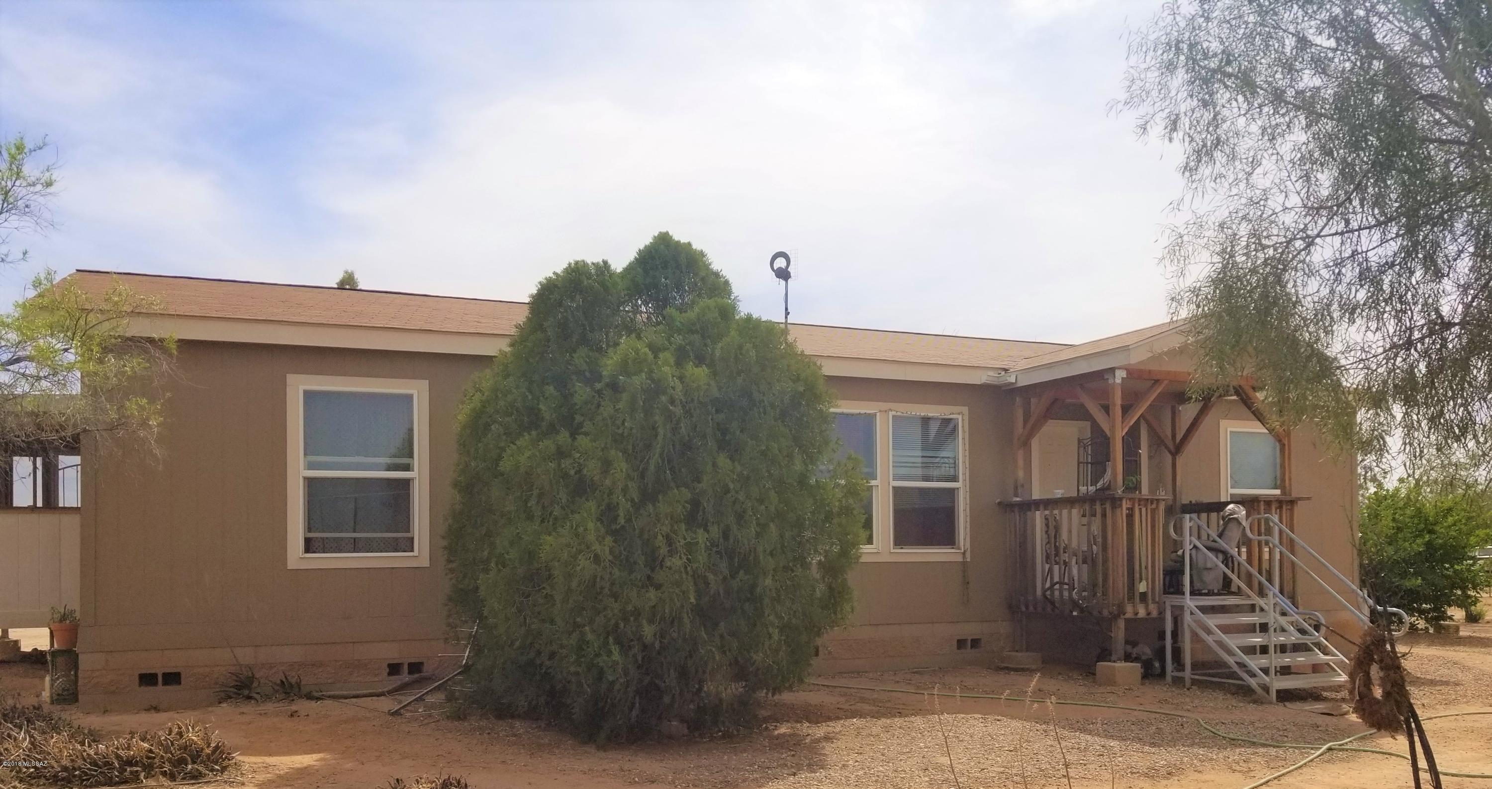 This is a well maintained newer manufactured home on a well kept 1+ acre lot. The views from the front are exquisite and the various fruit trees located throughout the property will have you forgetting that we live in a desert. The inside has been meticulously cared for and you will appreciate that as the living room opens up to the kitchen and dining area making for a wonderful family gathering space.