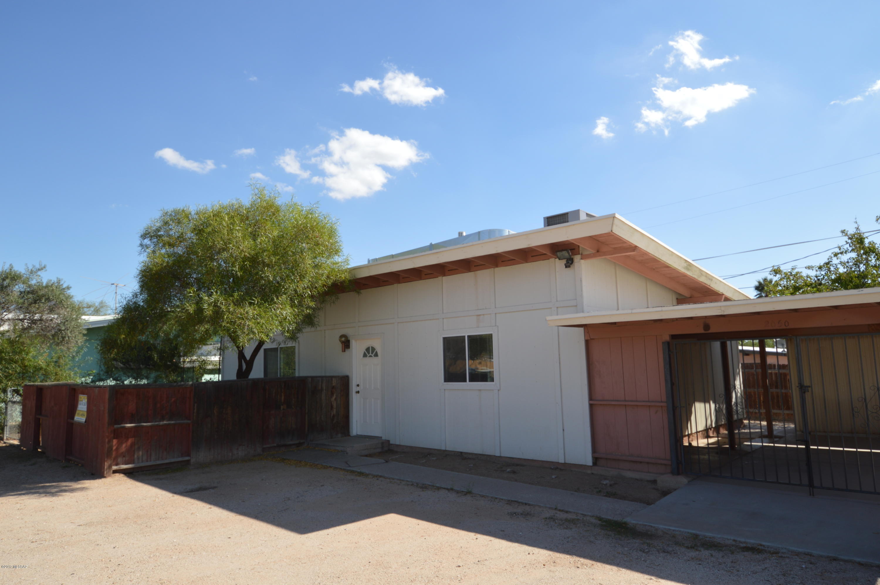 Remarkably remodeled! Wood floors, ceramic tile. Vaulted ceilings and open floor plan make this one look much bigger than it is! Gourmet kitchen with breakfast bar. Large fenced yard with separate storage shed off carport. Remodeled bathroom with modern fixtures. This is convenient to Kino Parkway and EVERYTHING! Make your move today...CALL NOW!