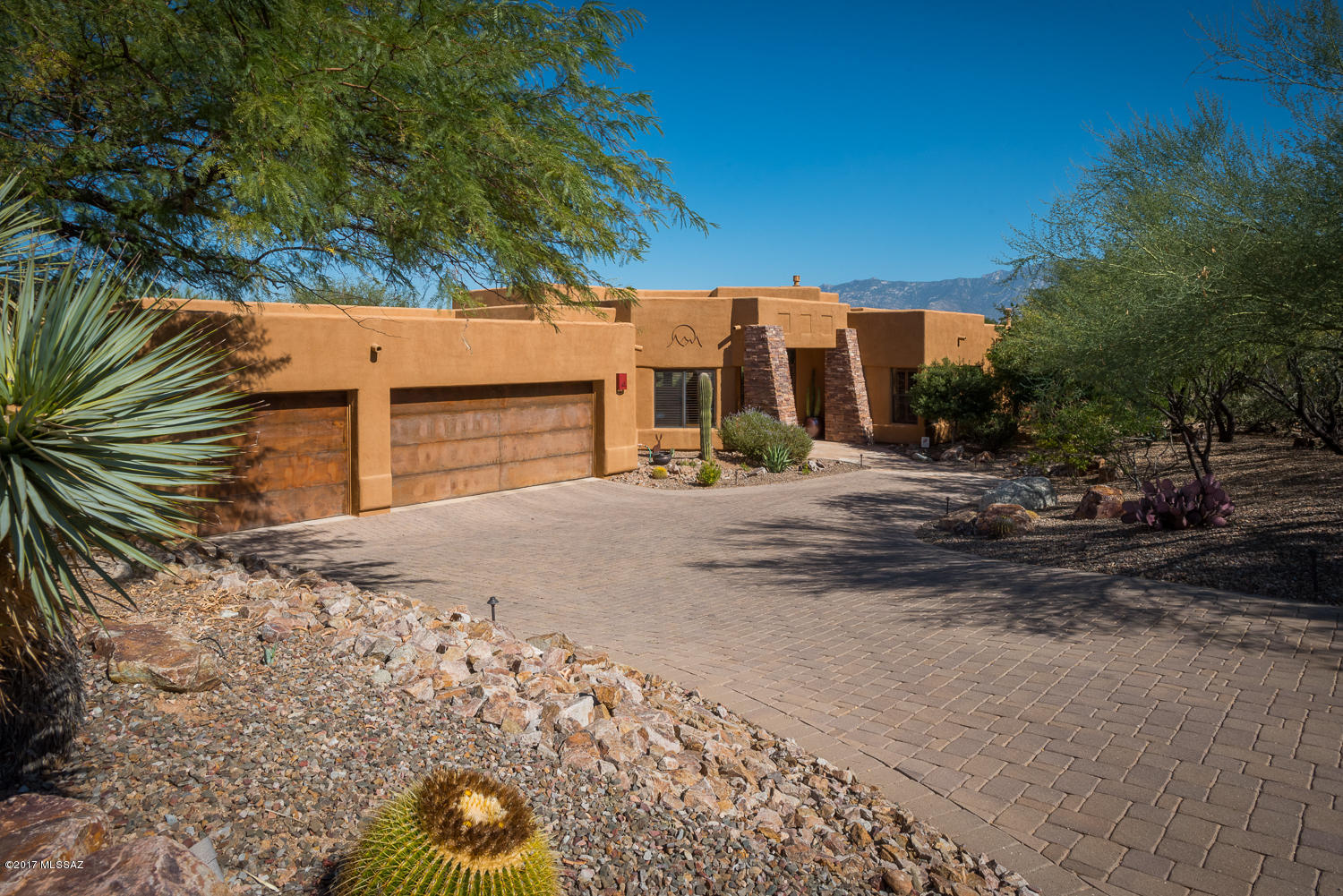 Exceptional contemporary estate situated on the ridge in Oro Valley’s sought-after Moonridge Estates, mixes elegance with casual living.  Rich finishes and attention to detail showcase outstanding craftsmanship of this 4 Bed/ 4 Bath/ 3264 SQFT estate.  The open flowing floorplan is complemented by soft textures and warm tones, showcasing the unobstructed Catalina Mountain views and taking advantage of filtered light.  Private + social outdoor spaces afford relaxation, as well as pleasure.  Gourmet Kitchen luxuries (by Davis Kitchen’s): Bosch + Wolf + GE Monogram + Master Chef SS appliances, island w/ prep-sink, roll-out shelving, ice maker, accented tray ceiling.  Master Suite: Travertine floors + vanities, glass tile accents, walk-in shower, jetted Kohler tub, custom lighting, ...... .... closets by California Closets.  All bedrooms include walk-in closets, with BDRMs 2 + 3 sharing a Jack-N-Jill bath w/ fine finishes.  Built-ins in den make for a cozy study/media room/office.  The backyard social space is equipped with a built-in BBQ, Kiva Fireplace w/ banquette seating, fruit trees, synthetic turf, Pebble-Tec pool + Spa w/ rock water feature, and lighting by Night Effects.  Please ask agent Property Details List for additional detailed information.