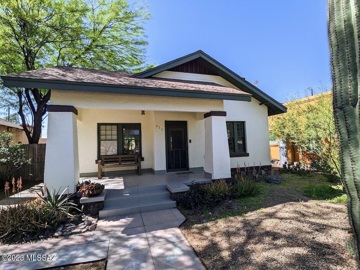 Absolutely adorable 1923 bungalow, a two bedroom one bath with guest/studio casita in historic Feldmans!  This one is a treasure, a gem, an oasis, and you feel it upon first stepping from the porch into the living room.  Hardwood floors, high ceilings, all of the charm remains.  Kitchen has been updated over the years, two bedrooms (or use the one with walls of glass as your art studio or office?)  The backyard oasis is shaded with well-established trees, shrubs, a veggie garden... it's lovely.   Then find the amazing studio casita, with everything you'd need for family, airbnb guests, or a rental unit!  The sliding gate to the alley provides great secure parking for two cars.  Note: fireplace is decorative only / original from 1923, as-is.