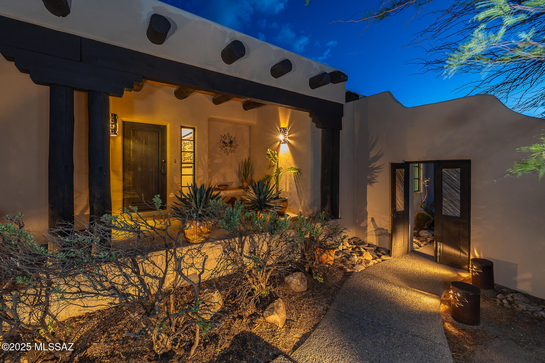 First time on the market this quality 3 bedroom, 2 bath, 2 car garage John W. Kline custom built Sante Fe home was built in the hillside and designed built to meet the home owners dreams.  Custom cabinetry, Vega poles and saguaro rib ceilings in living and dining room, and Corbels, 3 fireplaces, 4 panel wood-stained doors, Saltillo tile floors, and Talavera tile counter tops, steam shower in master bath, 3rd bedroom has loft with wood parquet floors adding to the charm. This well-crafted home is well maintained with newer wood casement windows, newly recoated roof, new double oven, newer dishwasher, newer air conditioner and hot water heater, and resurfaced spa. Located on 5.525 acres and borders on the Tucson Mountain Park in the private gated community of Twin Hills Estates.