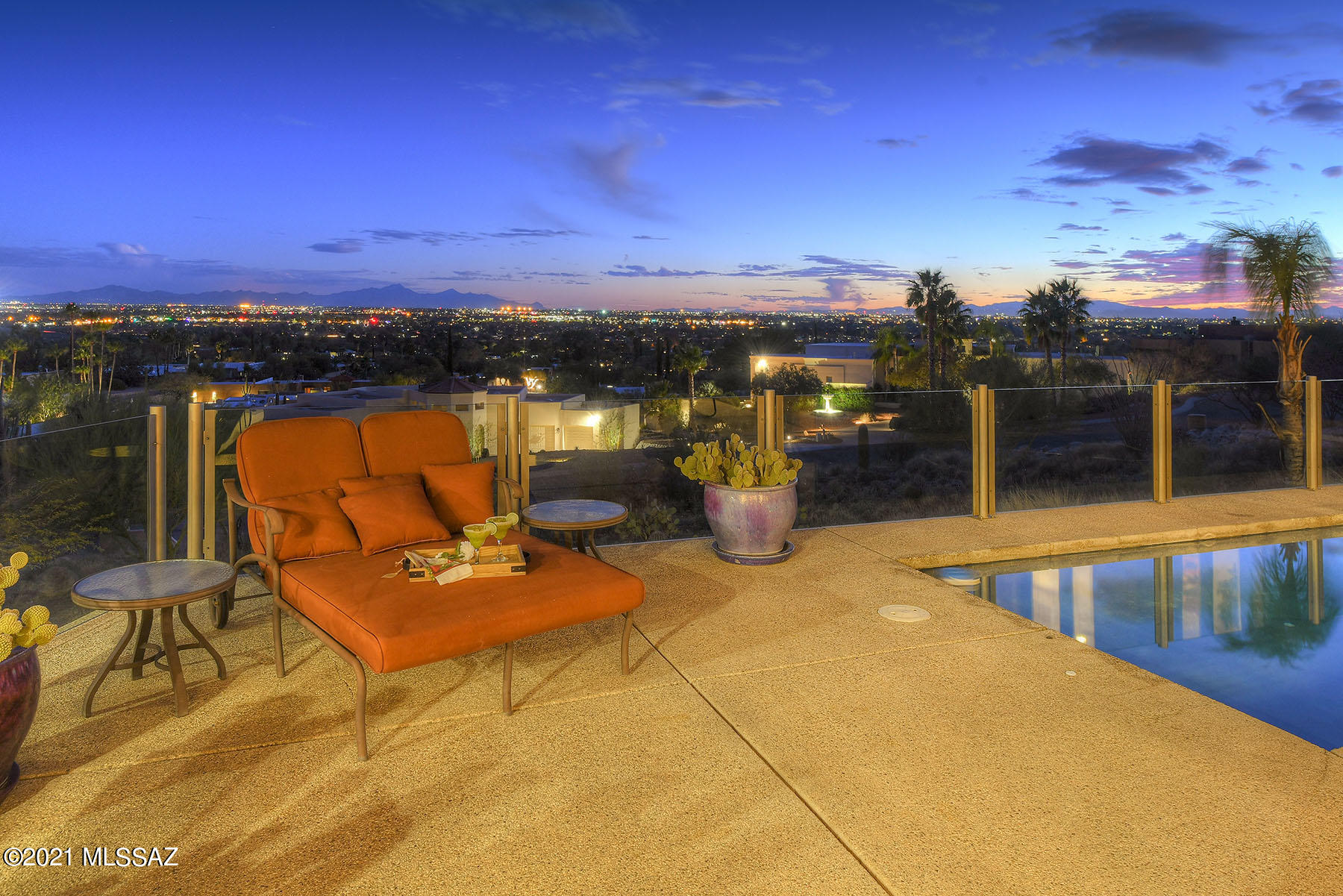 VIEWS VIEWS VIEWS! Marvelous home, situated high on the mountain side with amazing panoramic views of Tucson city lights, 3 mountain ranges and desert wildlife. Open great room contains remodeled kitchen, high ceilings, concrete floors and oversized windows that bring the magnificent views inside. Kitchen features stainless steel appliances and quartz counters including expansive island. Fabulous master suite has sitting room and access to patio & sparkling pool with clear glass panel fencing for even more unobstructed views of the valley! Luxurious master bath features separate vanities, jetted tub & 2 walk-in closets. Enjoy deer and desert wildlife from private backyard that looks directly up the mountainside with no other home in site. 2–car garage. Gated Mountain Cove Estates.