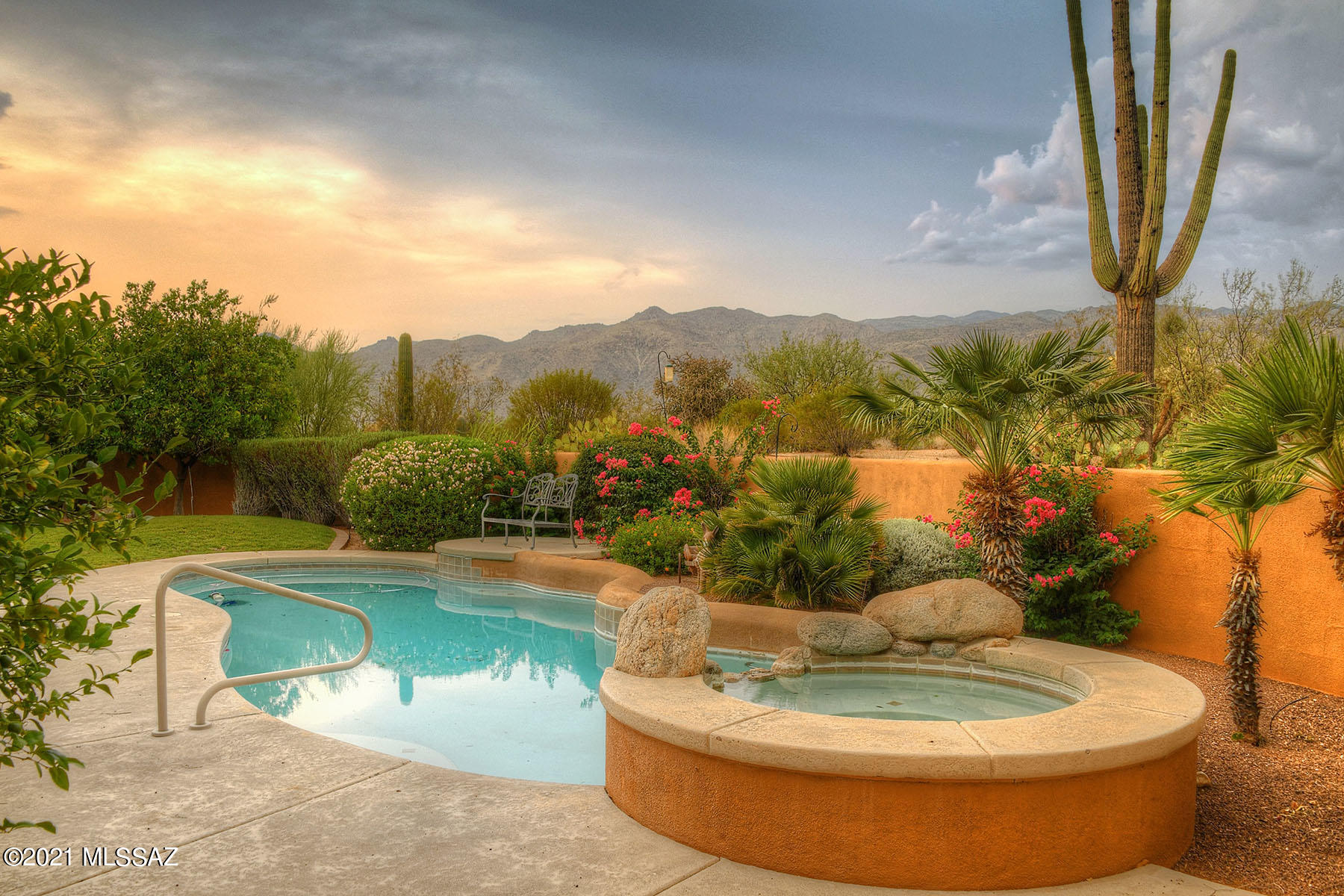 Scenic, private retreat w/ mesmerizing views! Nestled away in Tanque Verde Valley custom 4bd, 4.5ba, 3782 sq ft main house + 648 sq ft guest house. Long paver driveway leads to courtyard entry into stunning foyer & living room w/ fireplace, walls of windows, desert & jaw-dropping mountain views. Travertine flooring & 9ft knotty alder doors. Split floor plan offers privacy w/owner suite on one wing w/spacious bath, dressing area, 2 walk-in closets, fireplace & private office. Patio access from every room. Kitchen is highlighted by beautiful cabinetry, walk-in Pantry, Granite countertops, island w/ prep sink & bay window breakfast nook. Gourmet cook's delight w/ stainless appliances, double ovens & 5 burner gas range w/ hood. Family/Great room off kitchen ideal for entertaining. See MORE tab The guest quarters are tucked away on the opposite side of the home, featuring 2 bedrooms w/ jack & jill bath & third bath with patio access. Dine alfresco under shade or relax by your outdoor fireplace enjoying the stunning mountain views & majestic saguaros. Backyard is ready for your next gathering with outdoor kitchen that overlooks the sparkling pool & spa. 4 gas fireplaces, including one on sprawling covered patio. Separate Guest house w/ eating area, living room, kitchenette, large bedroom, walk in closet & full bath. Nothing can built behind. Views as far as the eye can see. XL 3 car garage. Shopping, schools, recreation & restaurants nearby. Tanque Verde Schools. One owner.