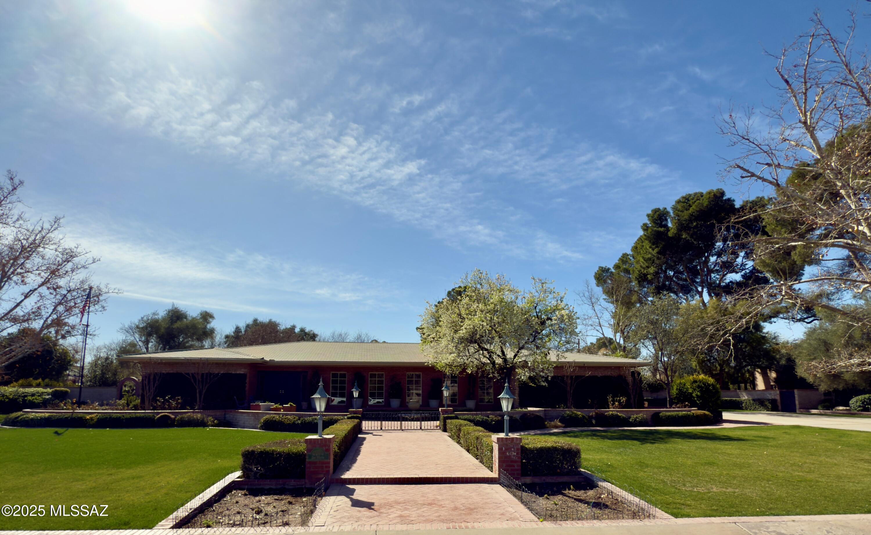 Sophisticated and timeless, this classic ranch home is nestled in the prestigious guard-gated Tucson Country Club Estates. Lovingly maintained by one family for 53 years, this property exudes charm and character. Boasting 4 spacious bedrooms and 3 well-appointed baths, the home is complemented by a cleverly designed detached pool house/cabana, complete with its own bath, perfect as a private office, gym, or guest retreat.