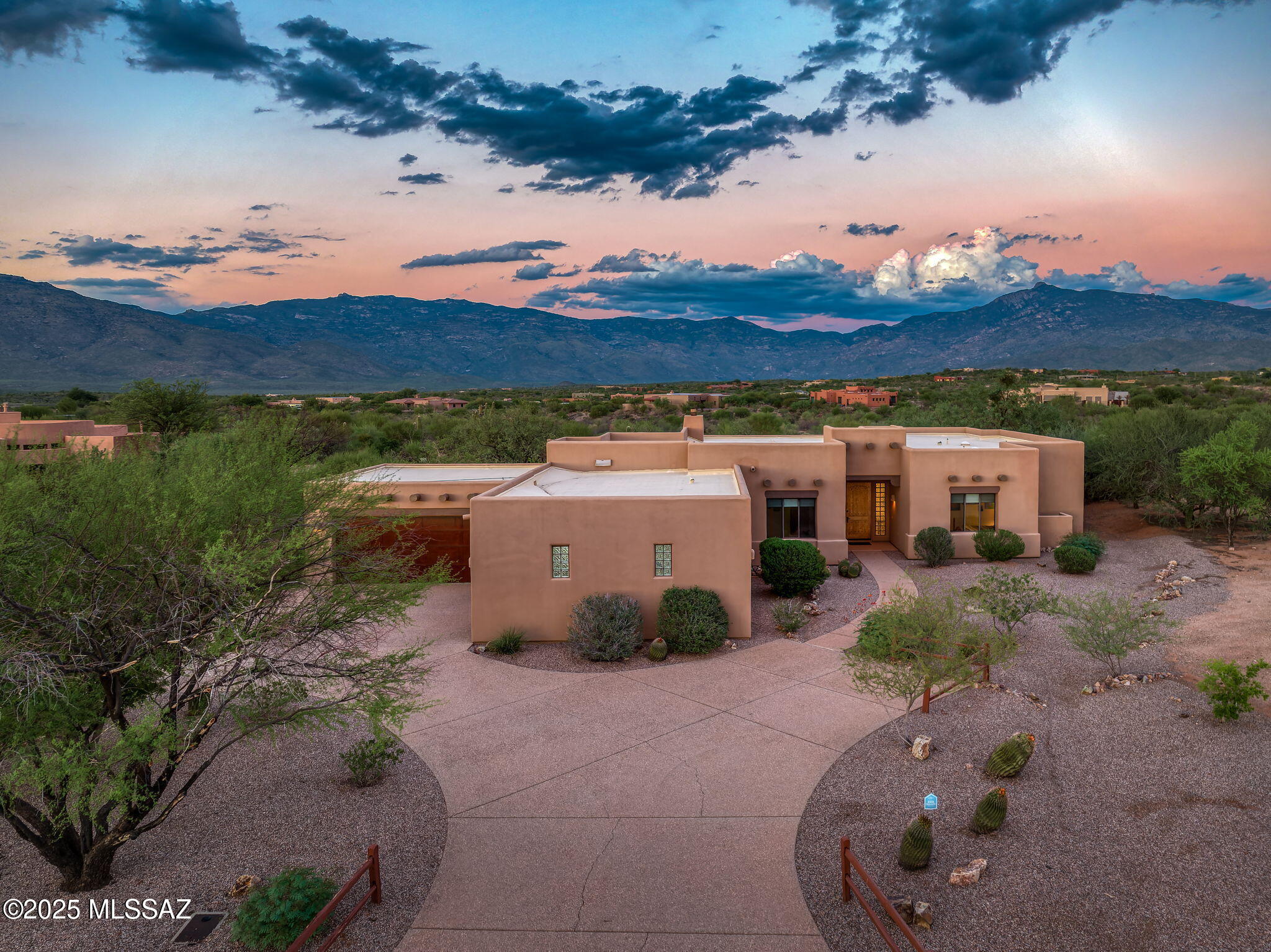 Situated on a Prime 1.57 acre lot with abundant Panoramic Mountain views in gated Coyote Creek this original Owner custom home covers all the ''wants'' in a classic Southwestern home. Fantastic Great room design has 2,712 sf of living space w/ 4 bedrooms & 3 full baths. Enter the Foyer and instantly feel the warmth of exposed wood/viga beam ceilings, beehive fireplace, & neutral desert tones. Great room seamlessly connects to oversized covered patio overlooking Pebble-tec pool, spa, outdoor kiva fireplace, & manicured yard.  Oversized 4 car garage incorporates a designated workshop area w/ample storage & utility sink. Primary suite has private patio entry, large bathroom w/ soaking tub & walk in shower. Pride of ownership is evident throughout w/ updated systems & meticulous maintenance. Add'l Features: " Newer HVAC units (2019 & 2024) " Newer Water Heaters (2019) " New Spa Heater (2025) " Fully Rebuilt Septic system (2025) " Roof Maintained with Re-coatings and maintenance (2023 last re-coat) " Natural Gas Generac Back up System provides auxiliary power if needed. " Oversized Laundry room with built in cabinetry & Sink " Solid Alder Interior Doors " Built in BBQ  " Built in Speakers at living room & patio " Irrigation system for landscaping both Front & Back " All appliances stay " Enjoy outdoor activities, including hiking, mountain biking, cycling, birding and exploring at some of the nearby outdoor recreation areas which include: " Arizona State Trust Land + 0.6 miles " Colossal Cave Mountain Park + 3.3 miles o Arizona Trail +3 .7 miles " Saguaro National Park East + 8.0 miles " Coyote Creek Features " Horse Facilities " Pickleball Courts " Park  " Walking path " Basketball Court " Tennis Court