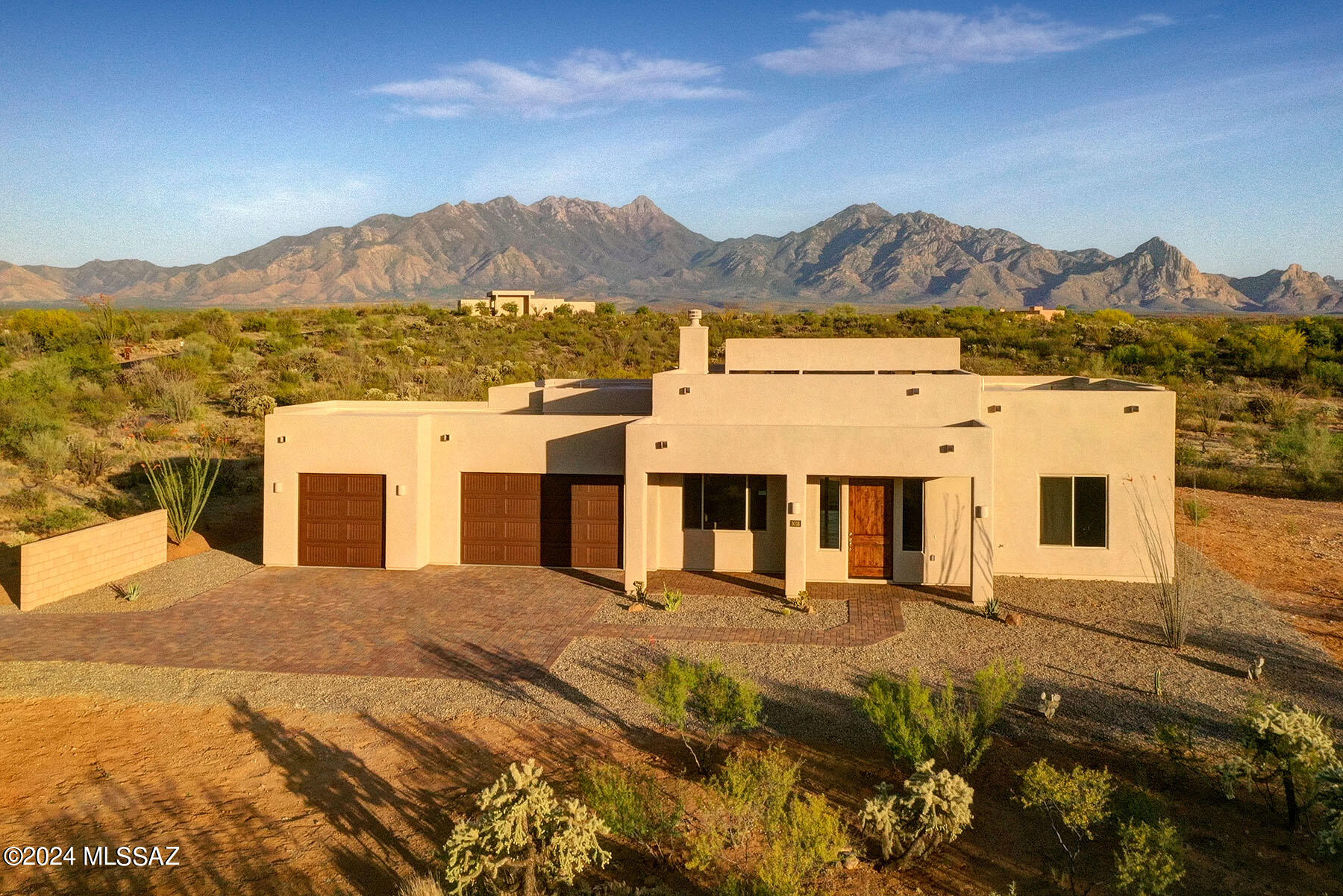 Stunning New Build located on a 1.89 acre lot nestled in the foothills of the Santa Rita Mountains with Spectacular Views in every direction! This home offers an oversized 3 car garage, 4 bedrooms/3 baths, plus a separate den/media room, 12' cathedral ceilings in the Great Room w/10' ceilings in bedrooms & hand scored/stained concrete floors thru out. The Gourmet kitchen features 36'' 
electric cooktop, double oven/micro, granite CT, big pantry, generous cabinet storage & large island w/breakfast bar to congregate and make those special memories. After a long day, retreat to your spacious master bd & enjoy the fabulous views from the bay window, draw a bubble bath or just curl up with your favorite novel. A must see!!! 
 Welcome Home! NOTE: Owner will consider possible short term carry.